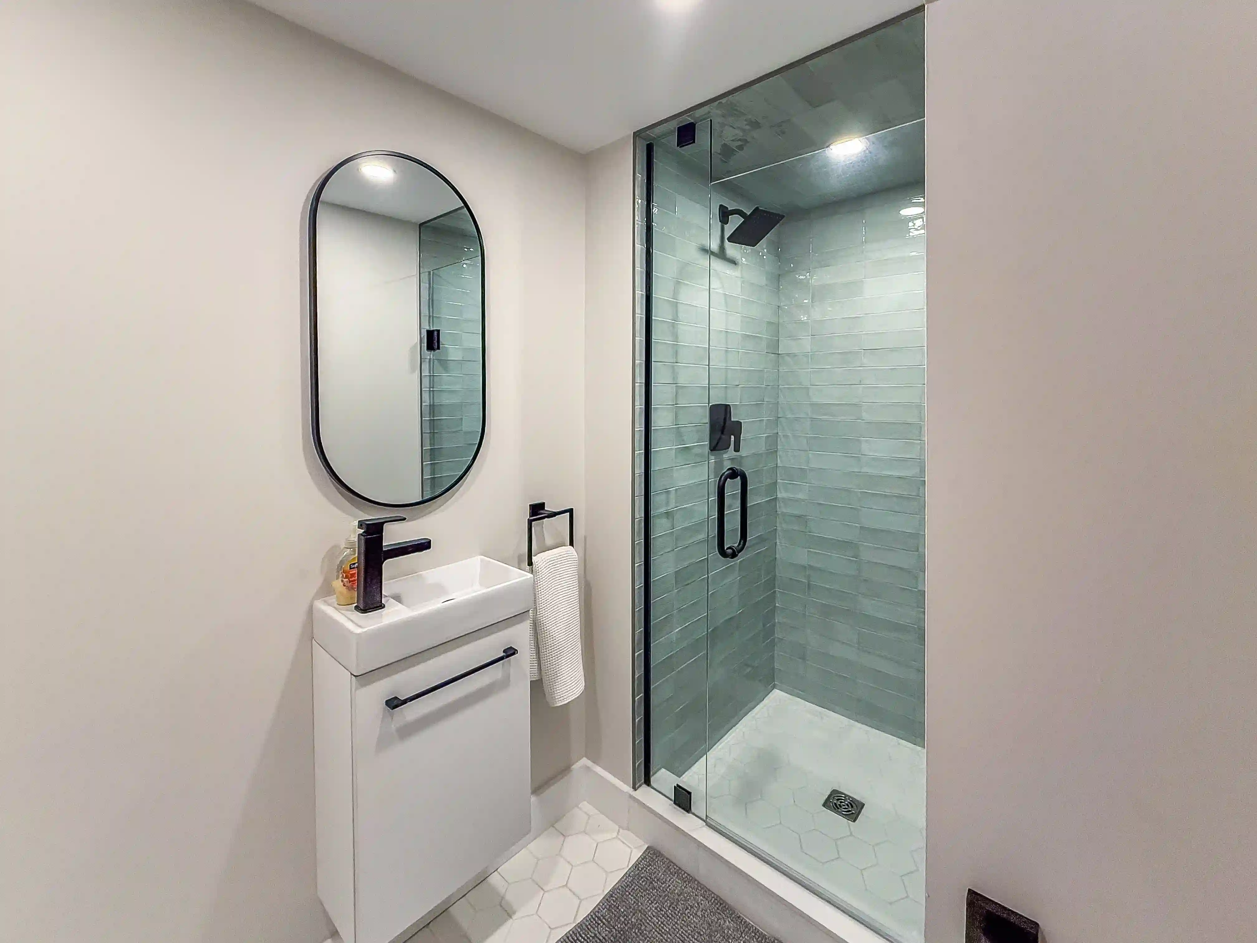 Bathroom vanity and glass shower