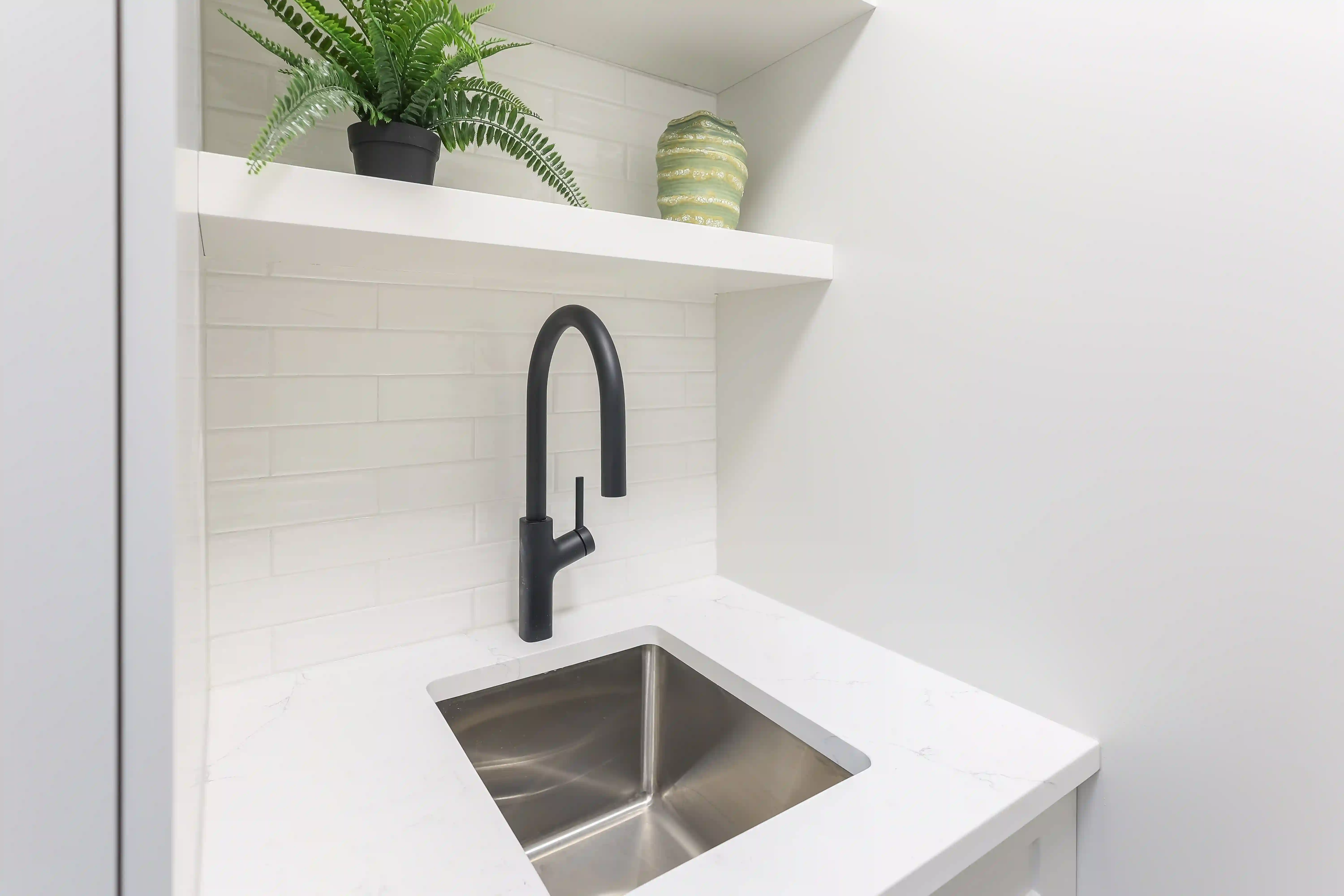 Laundry sink and open shelves
