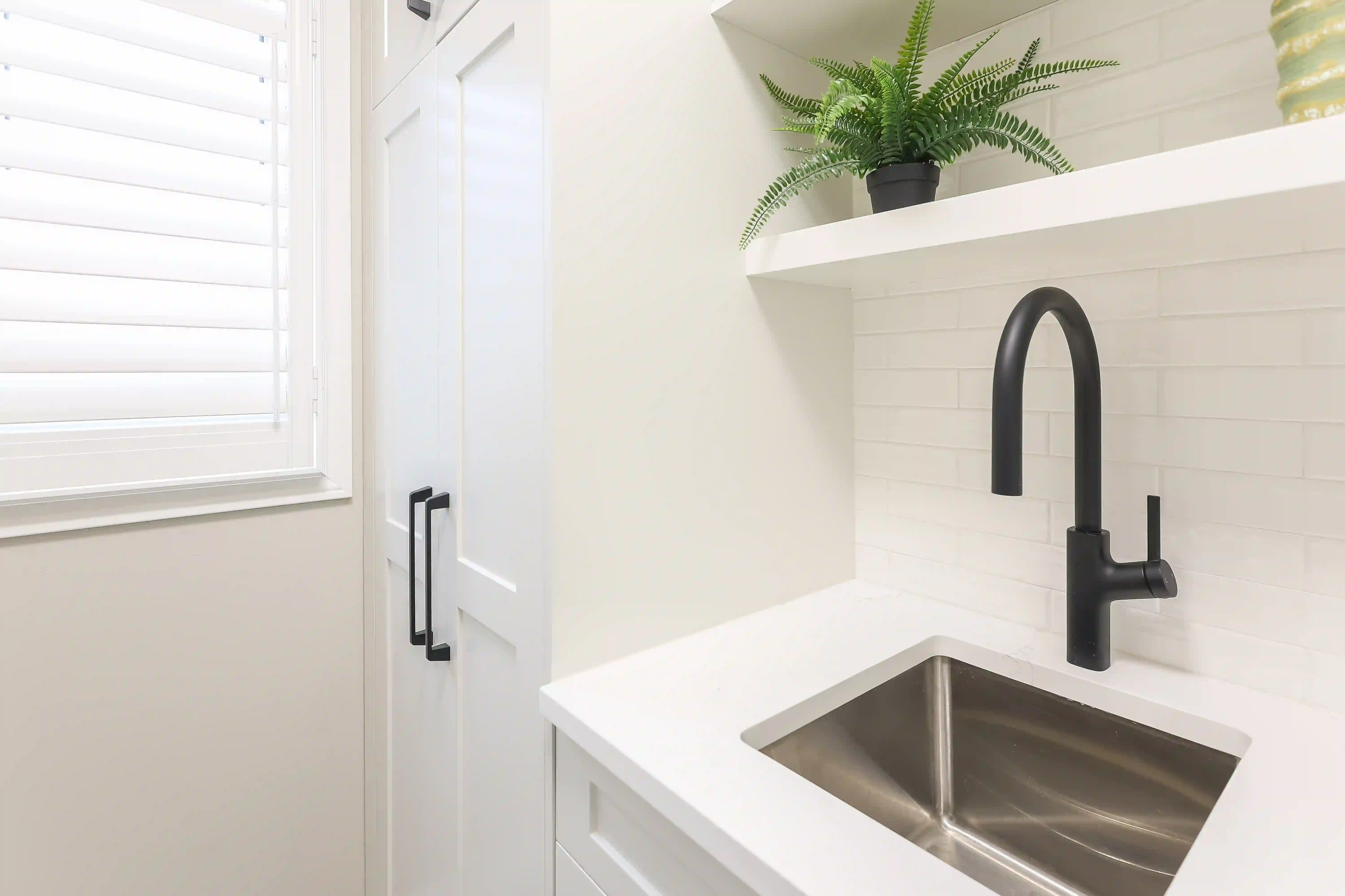Laundry sink and open shelf detail