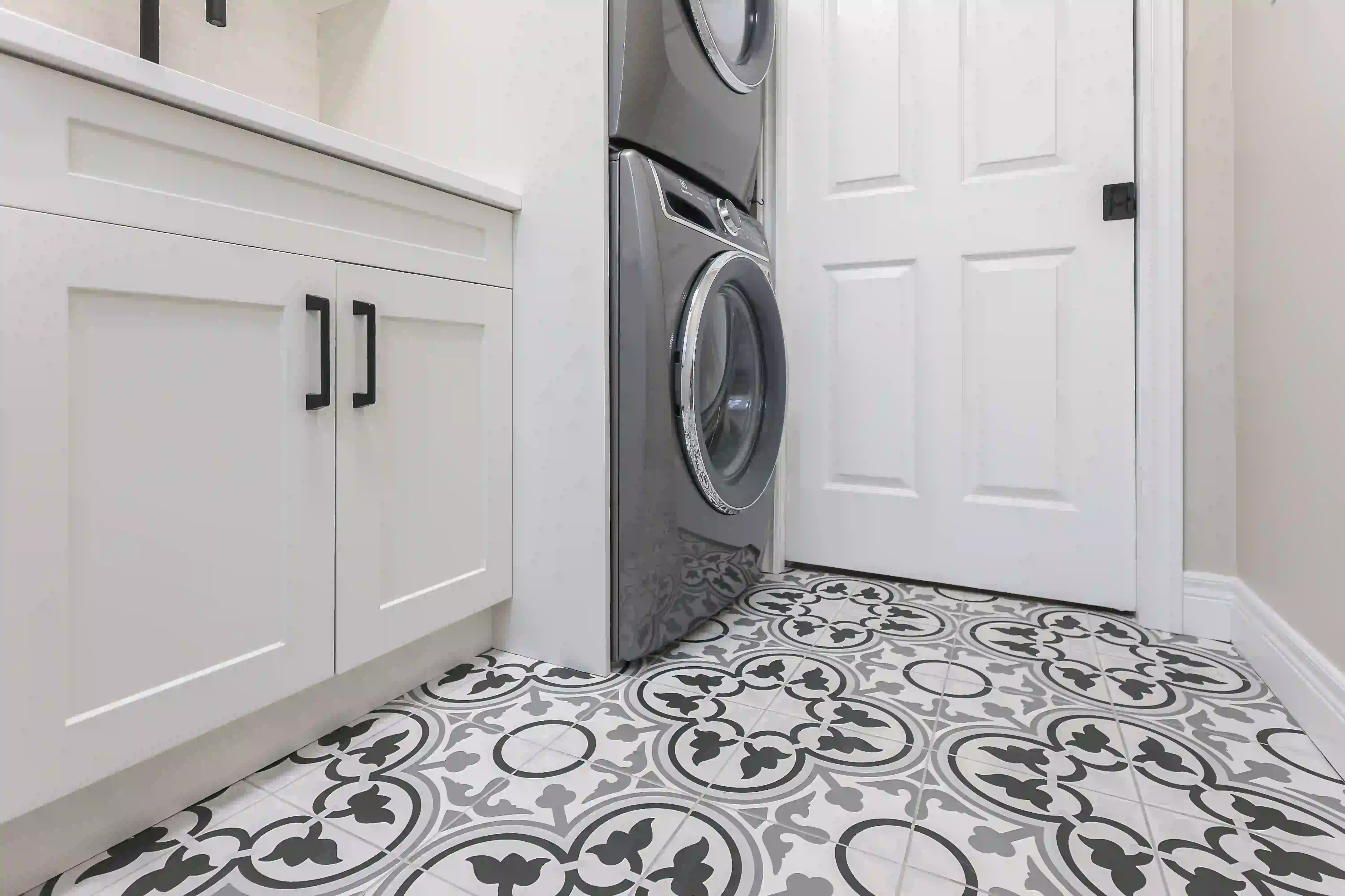 Stacked laundry and storage cabinetry