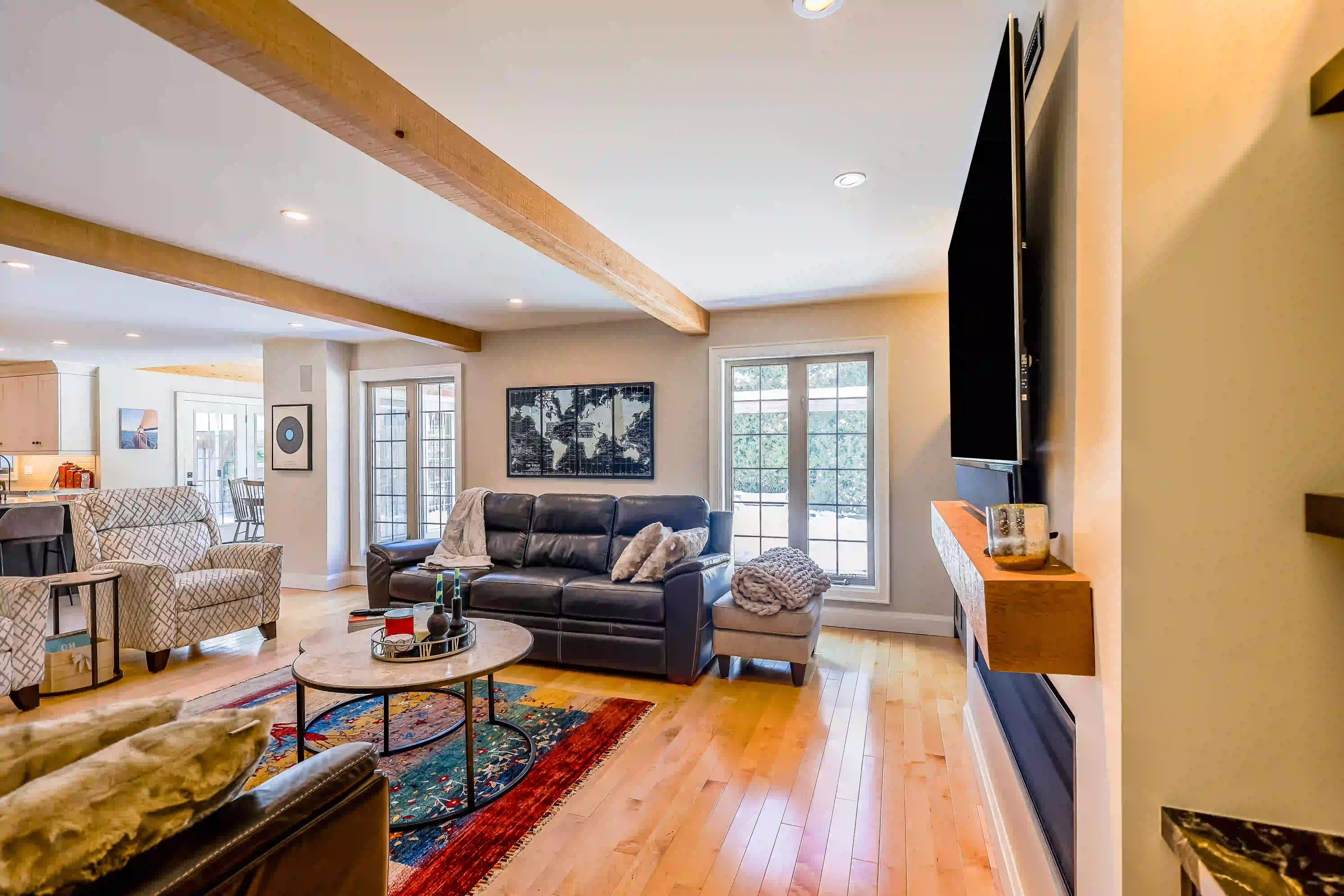 Open living room with wood beams