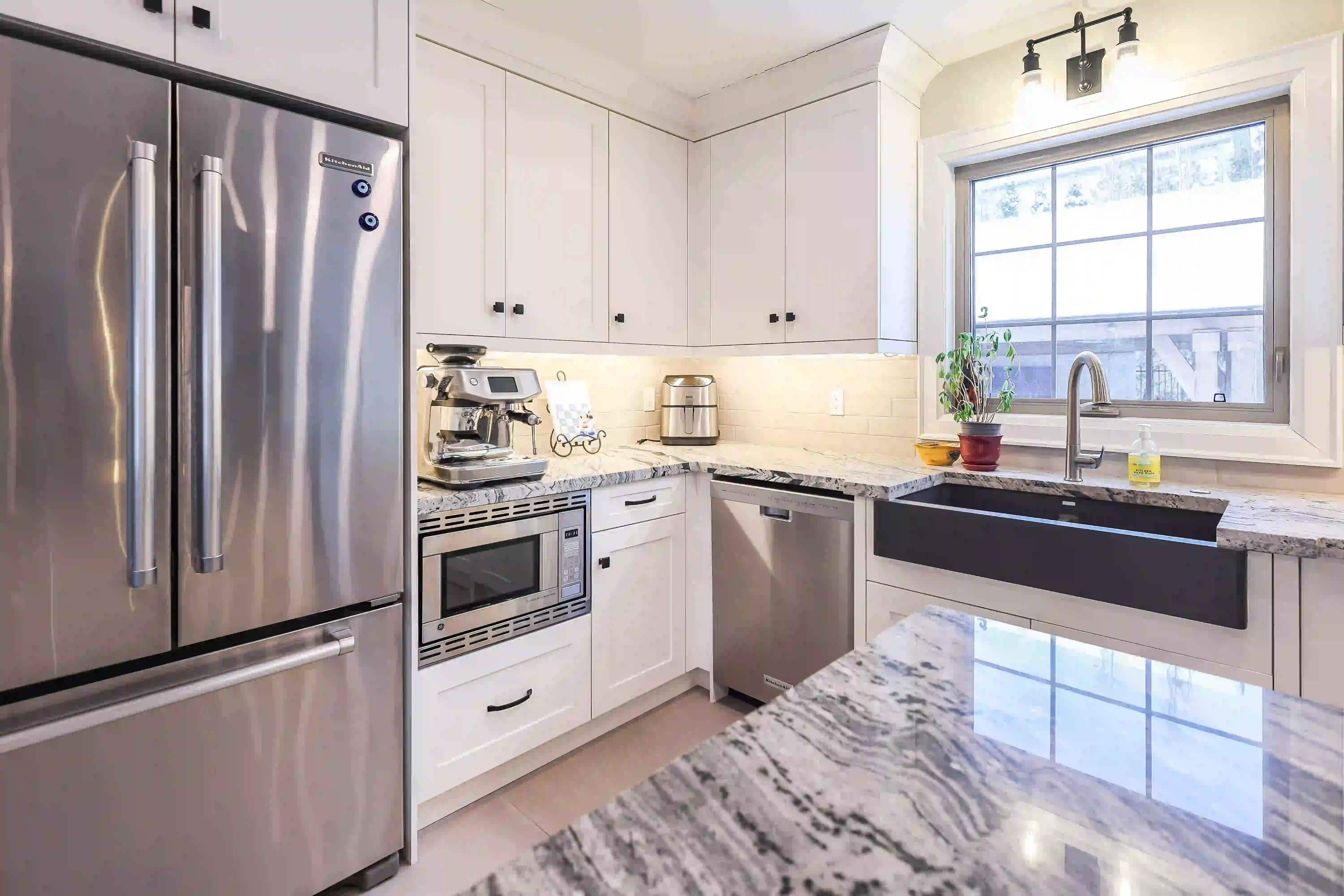 White kitchen with window over sink