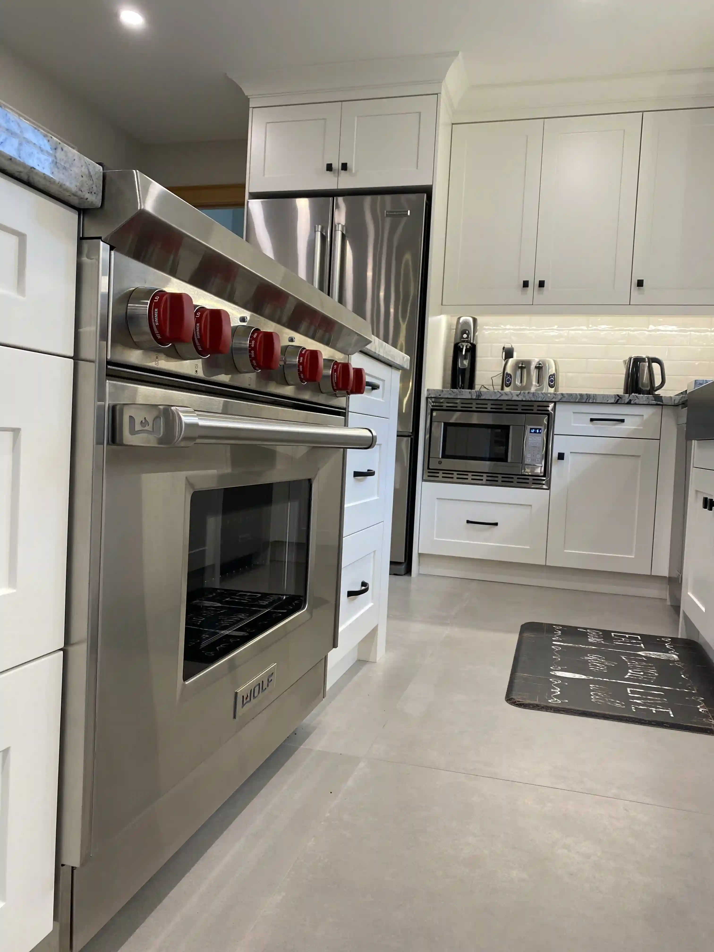 Kitchen range and white cabinetry