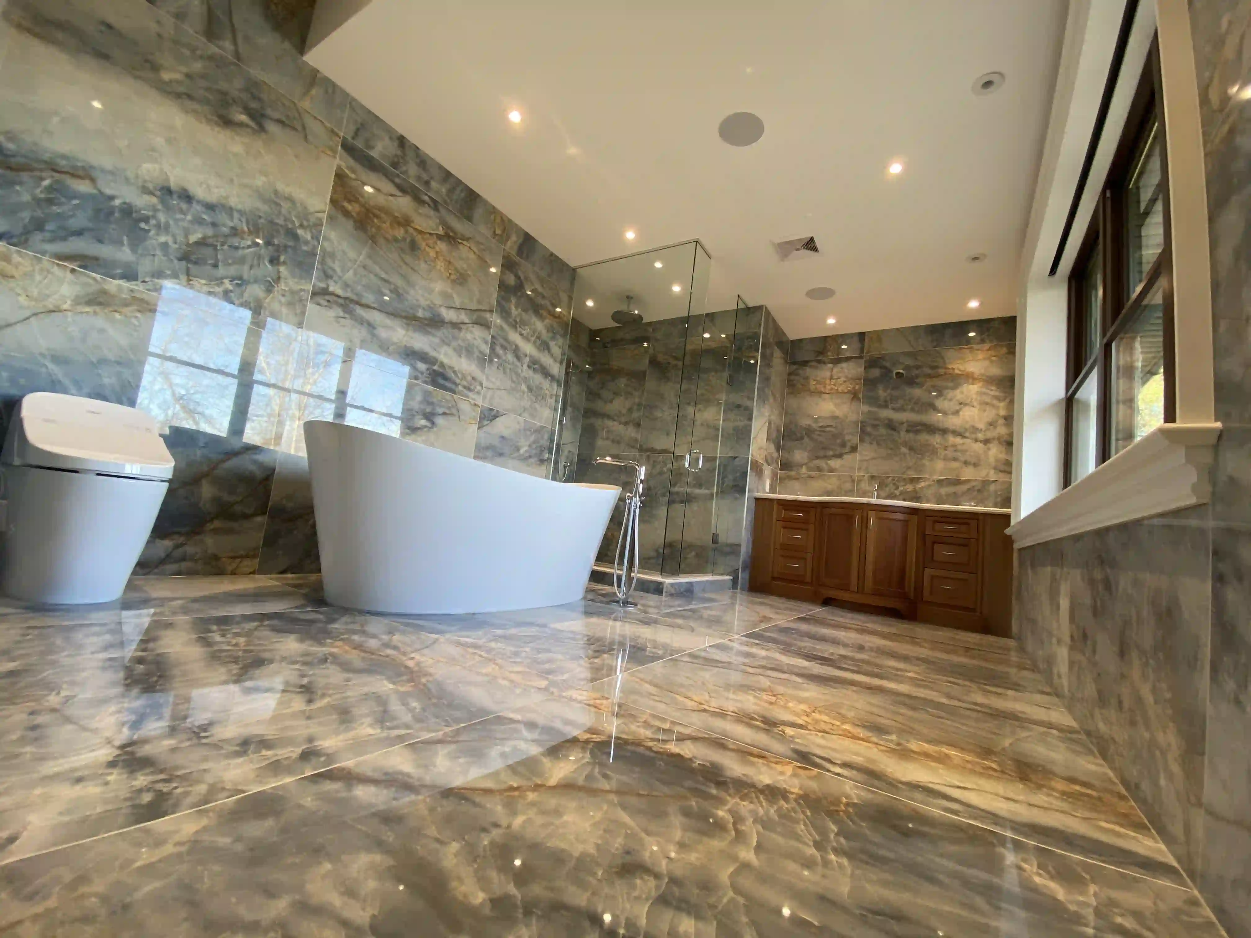 Marble ensuite with freestanding tub
