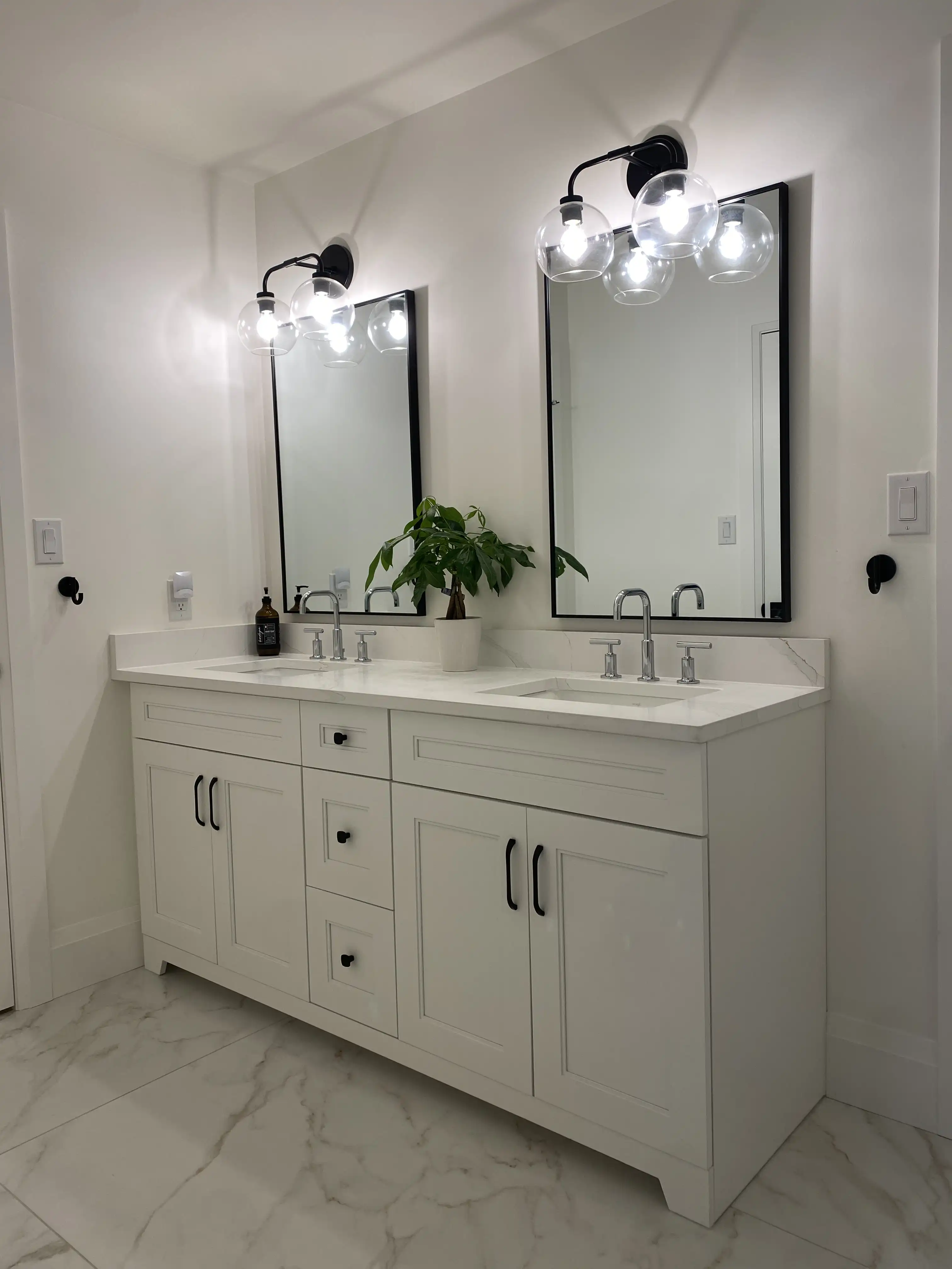 White double vanity and mirrors