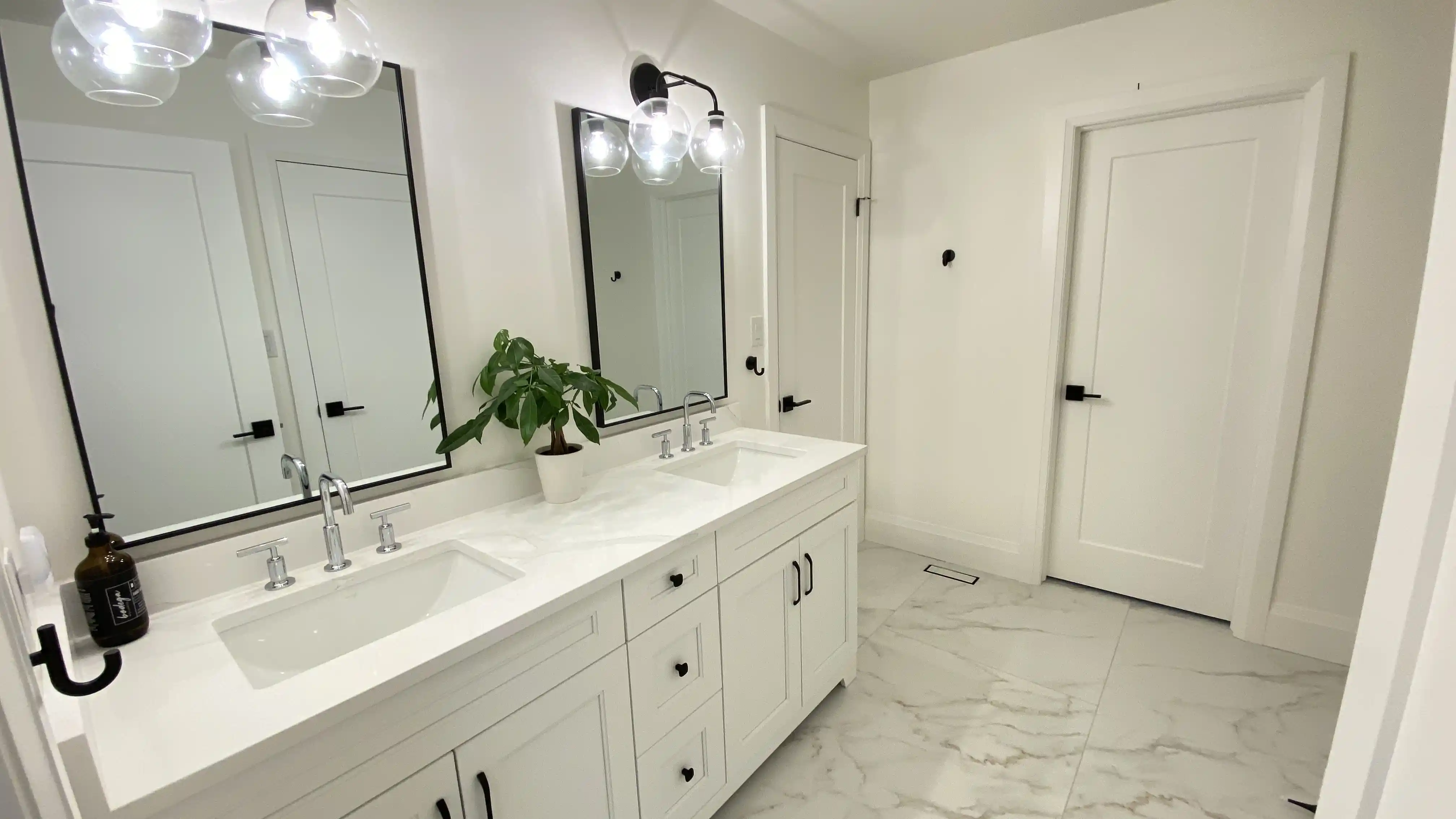 White vanity and bathroom entry