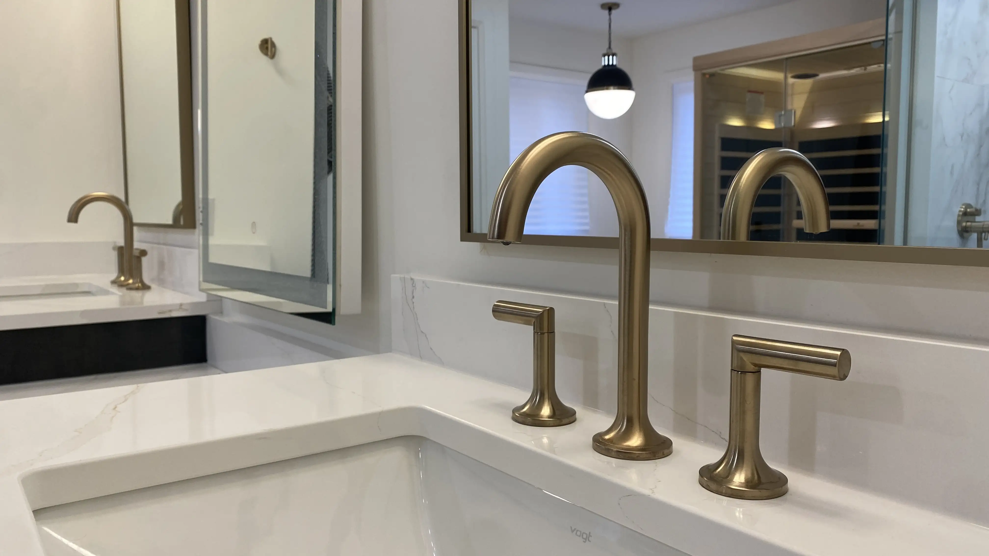 Brushed-gold vanity faucet detail
