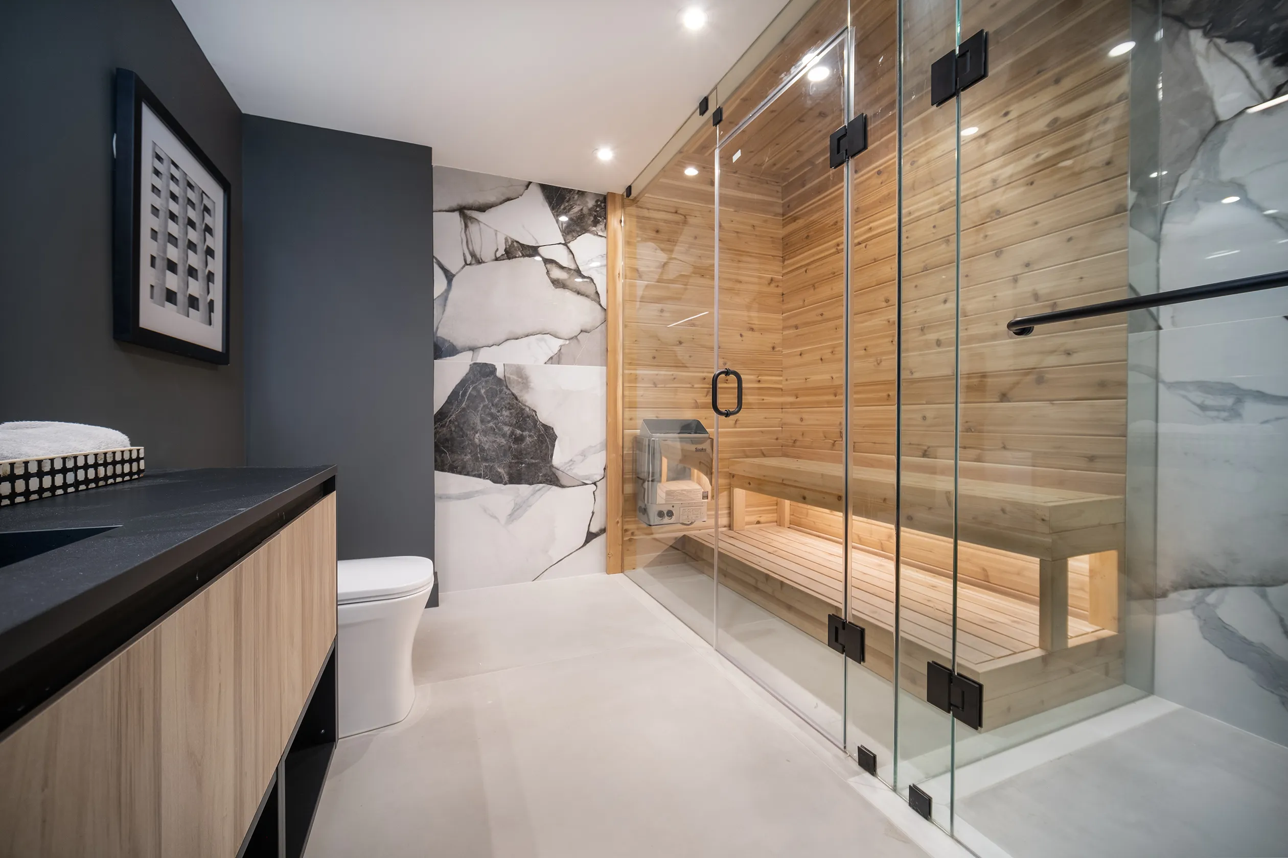Bathroom with wood sauna and glass shower