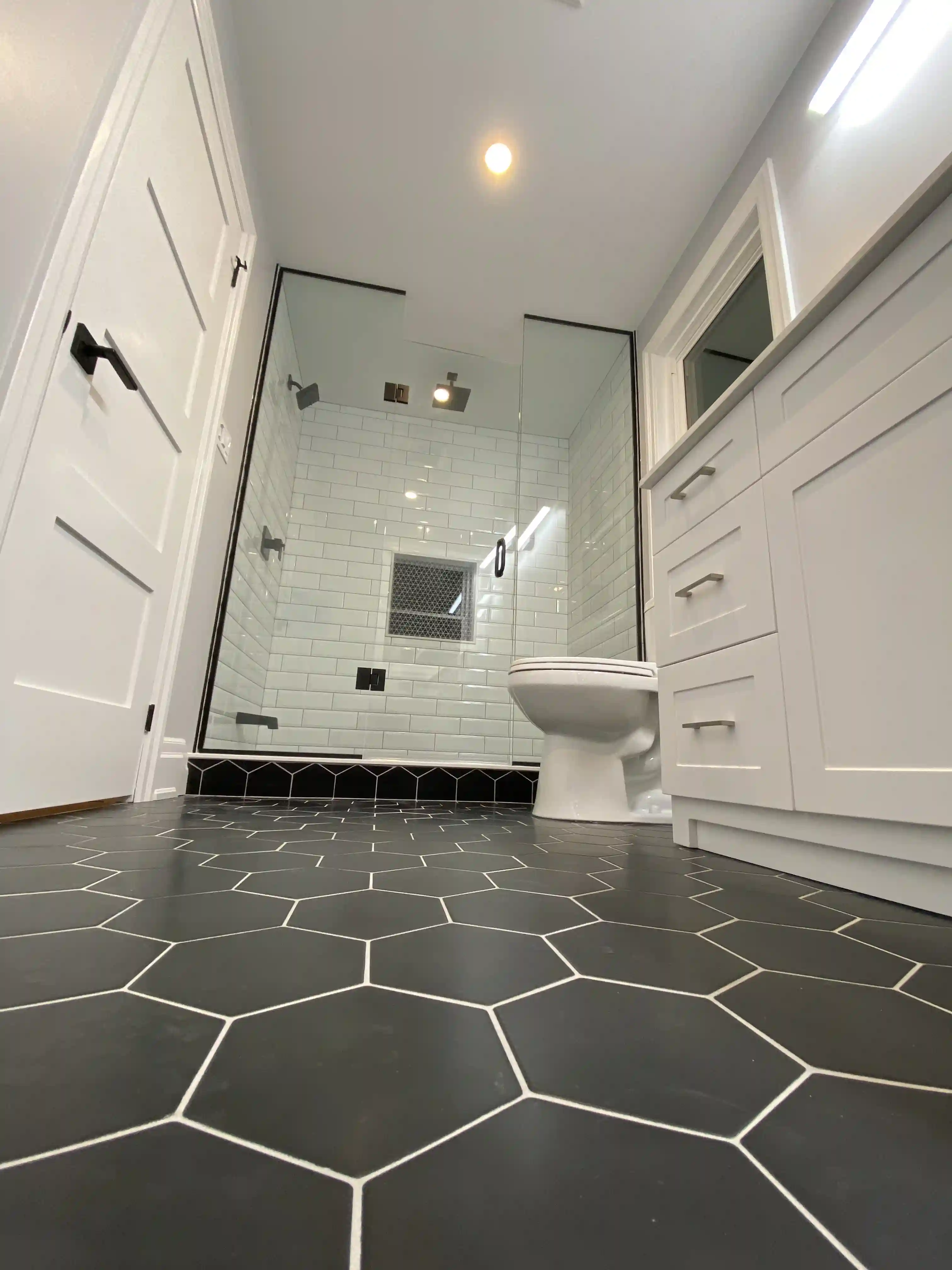 Bathroom with hex tile and glass shower