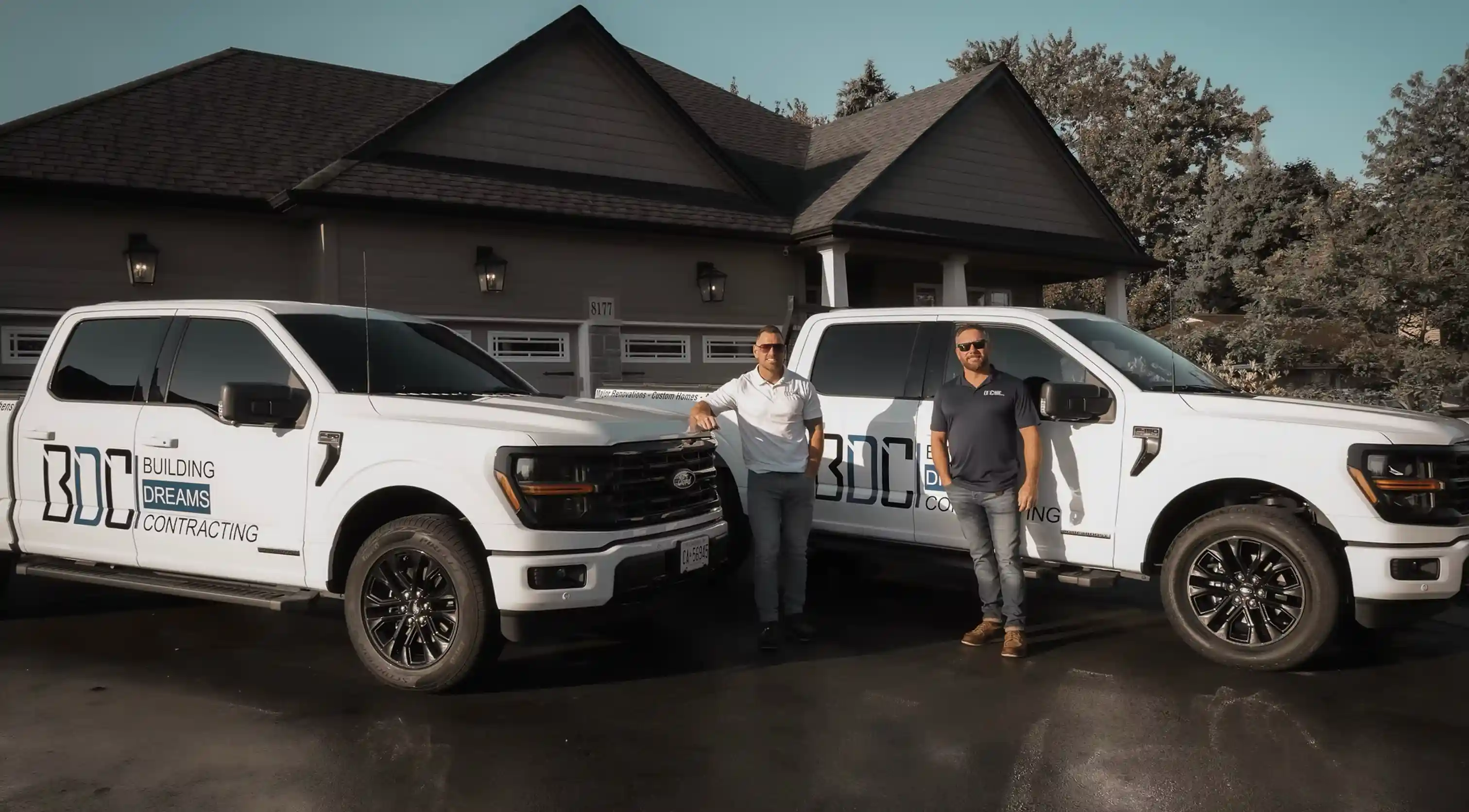 Building Dreams Contracting team with branded project vehicles