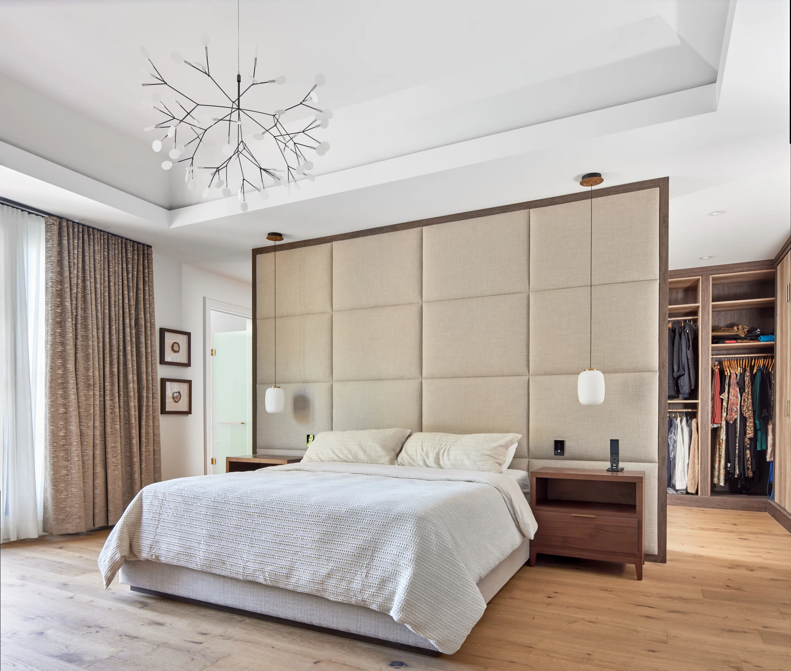 Primary bedroom with custom wall cabinetry