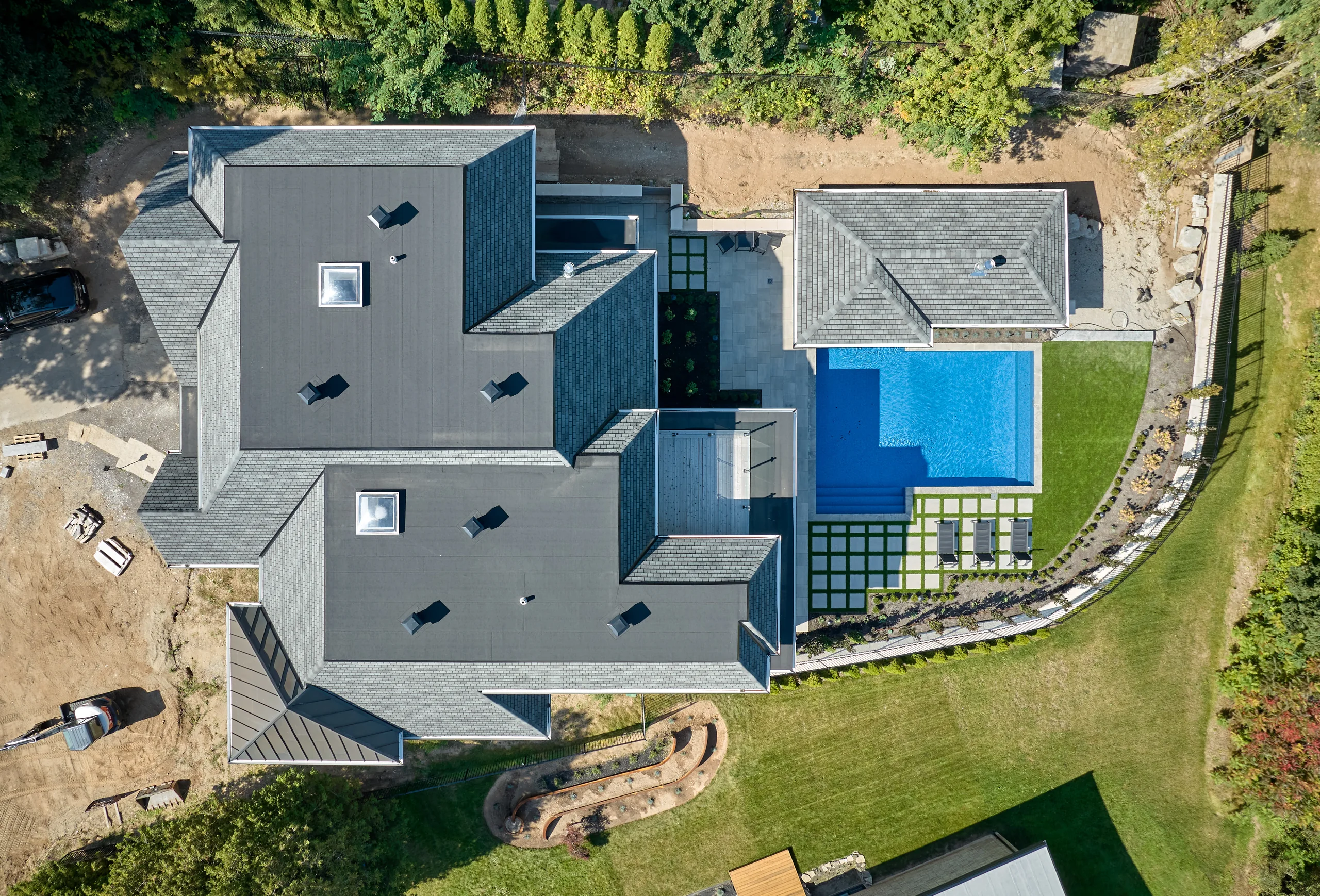 Aerial view of custom home and pool