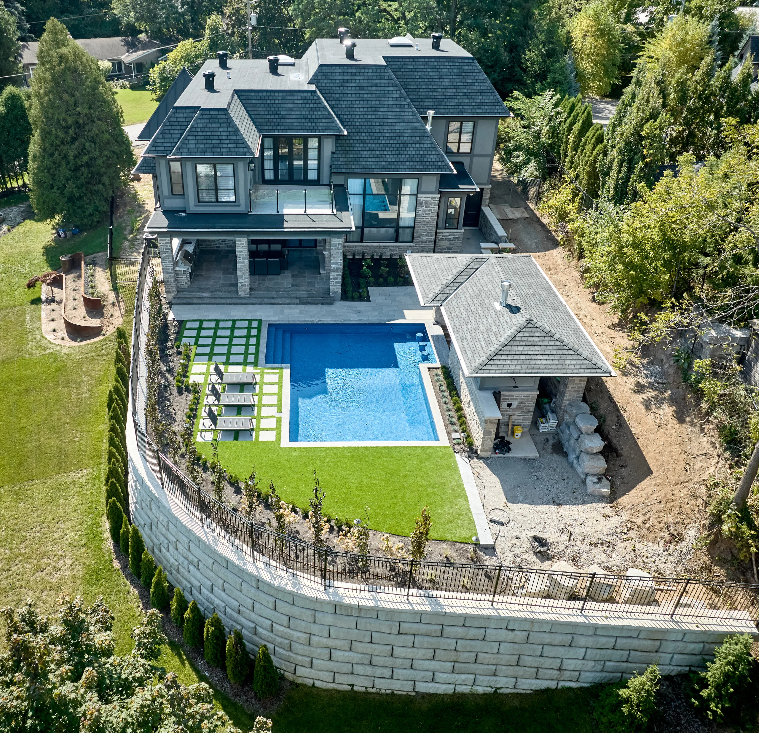 Aerial view of home on sloped lot