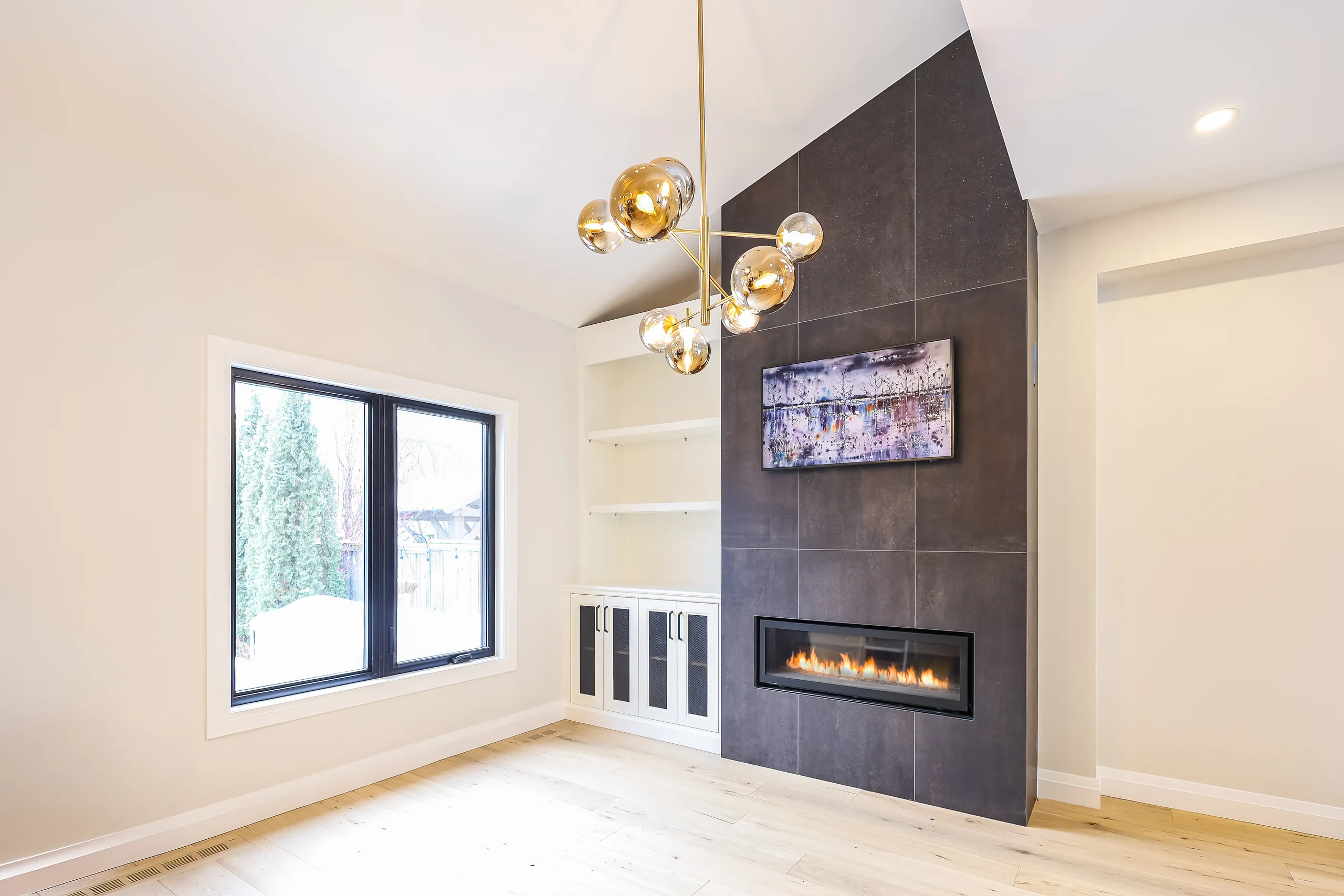 Living area with fireplace feature wall