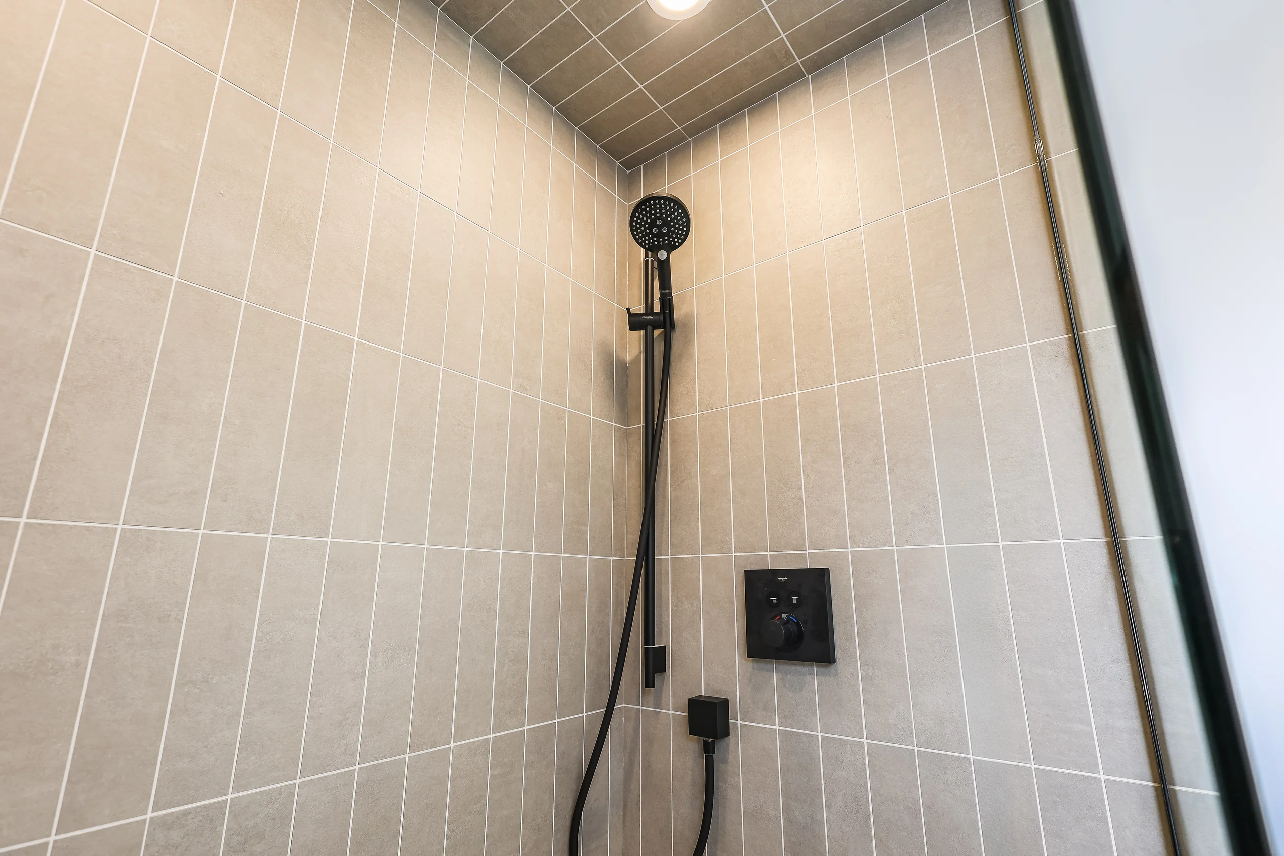 Shower tile and black fixtures