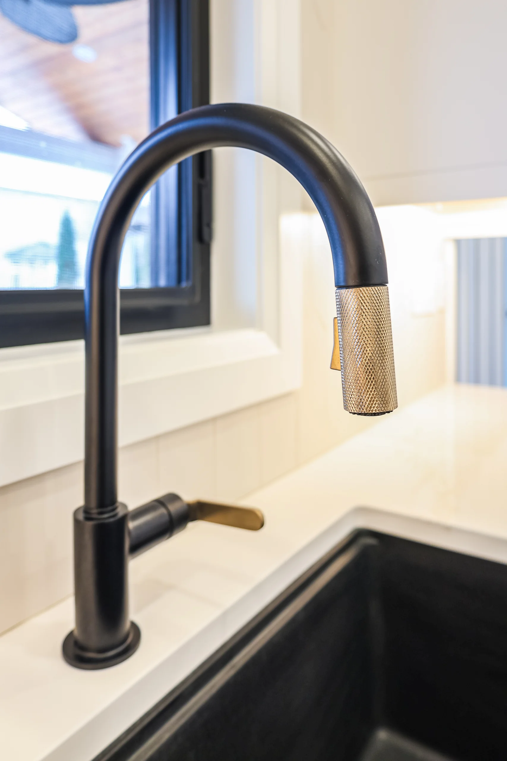 Black kitchen faucet detail