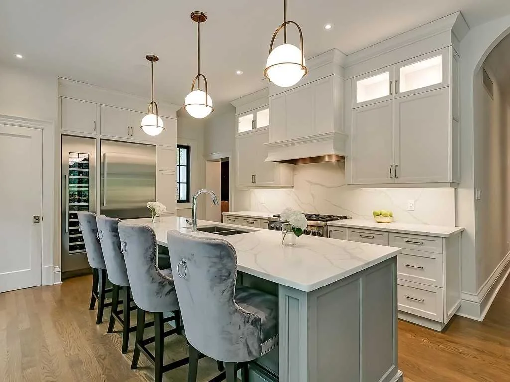 White kitchen island and pendants