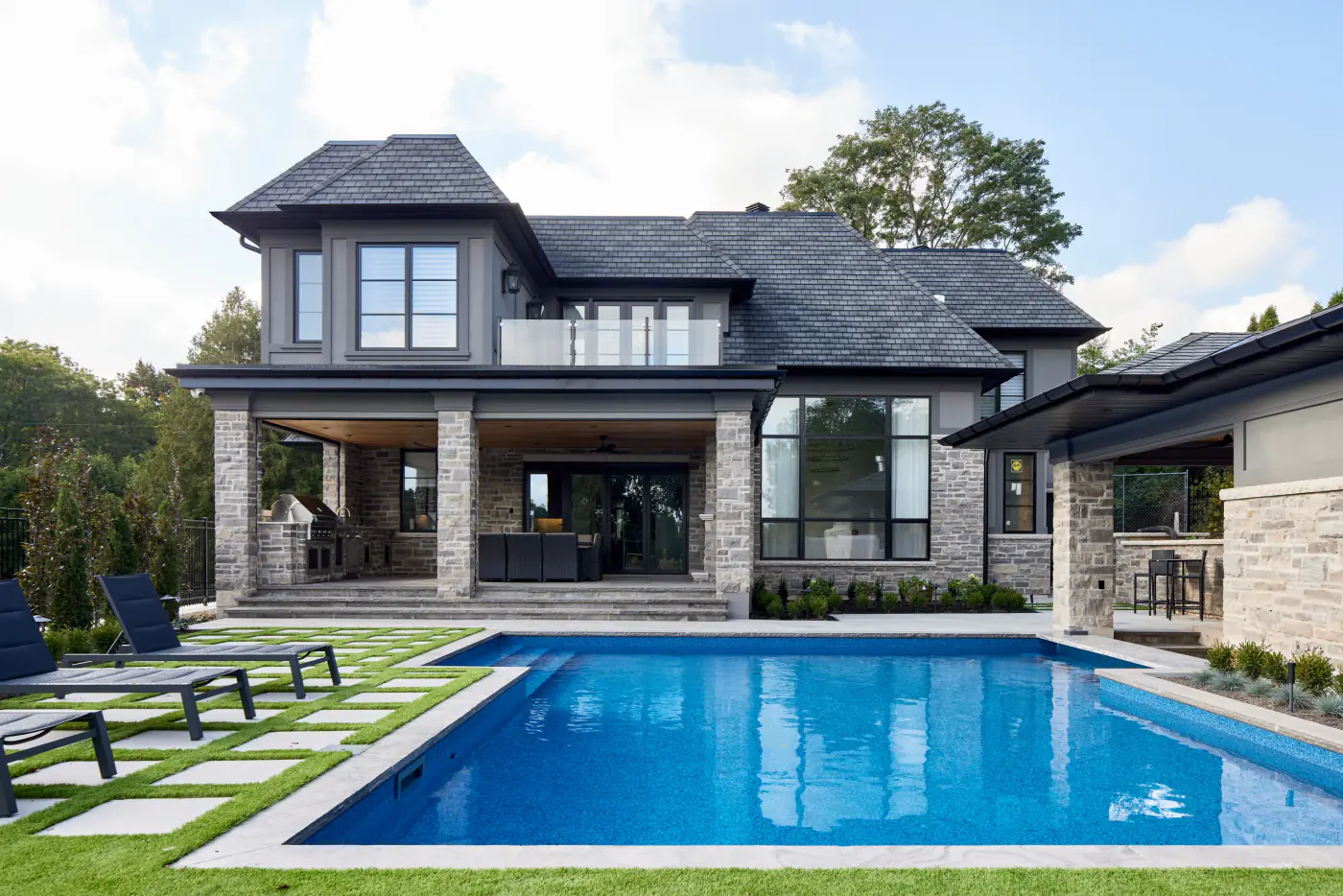 Custom home exterior with pool and outdoor living area