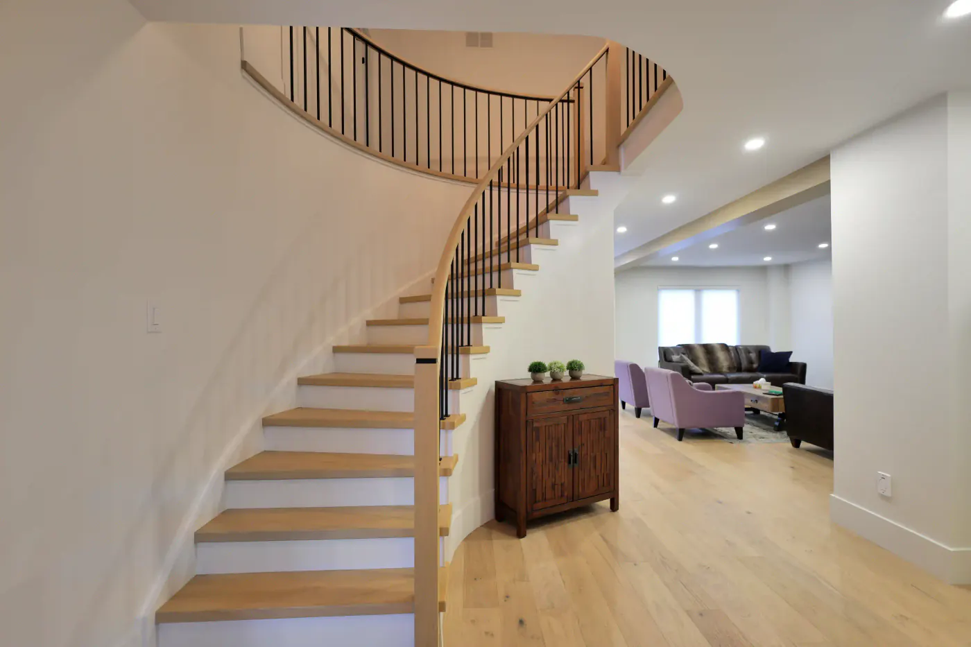 Curved staircase detail by Building Dreams Contracting