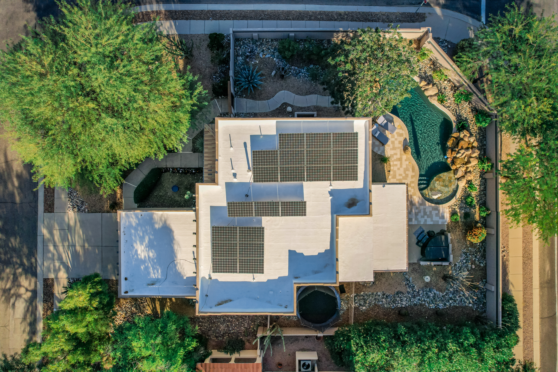 Drone view of a Southern Arizona home with rooftop solar