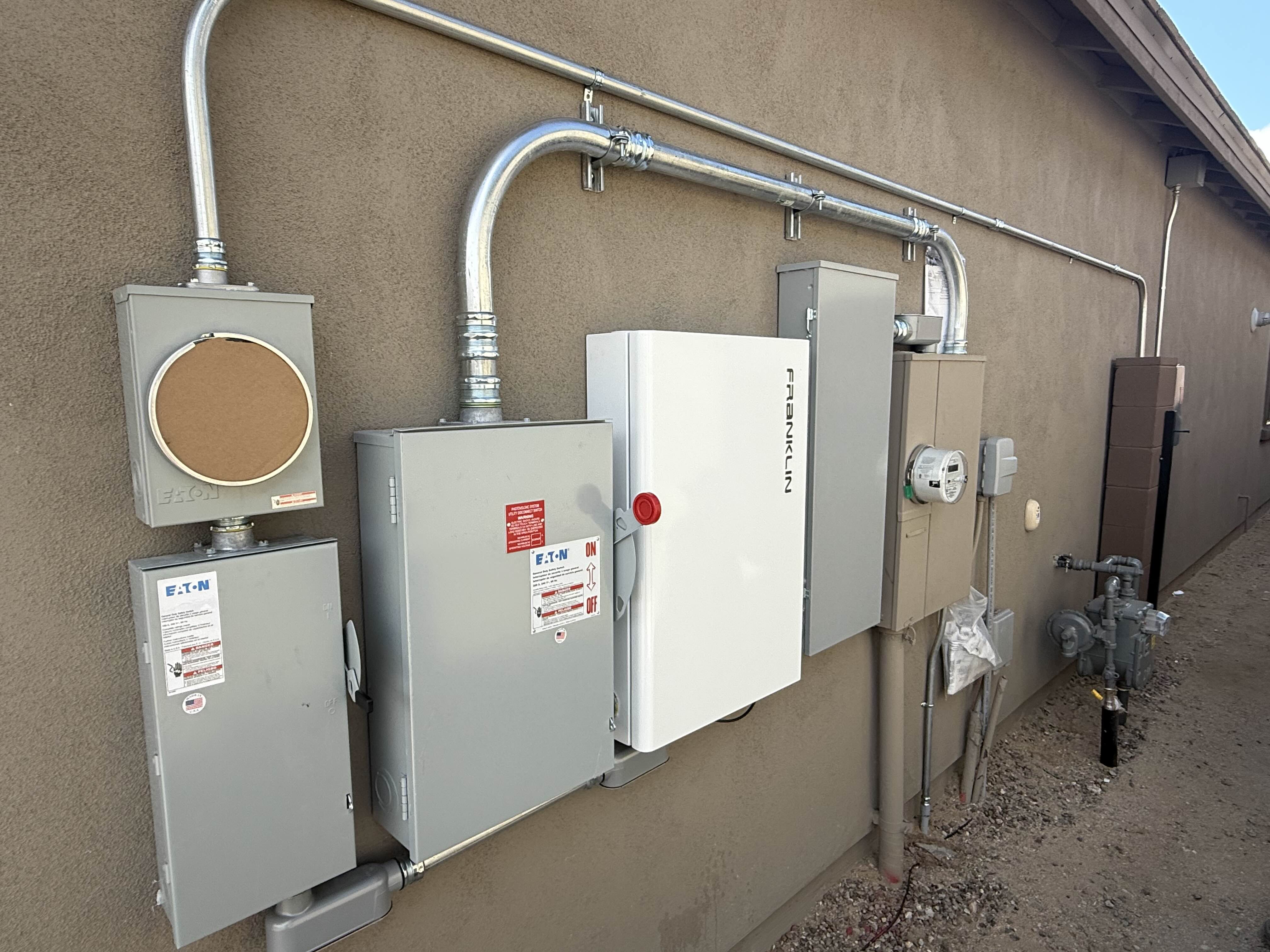 Battery gateway and electrical equipment on an exterior wall