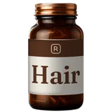 An amber glass bottle with a copper cap and a Hair label with an R monogram.