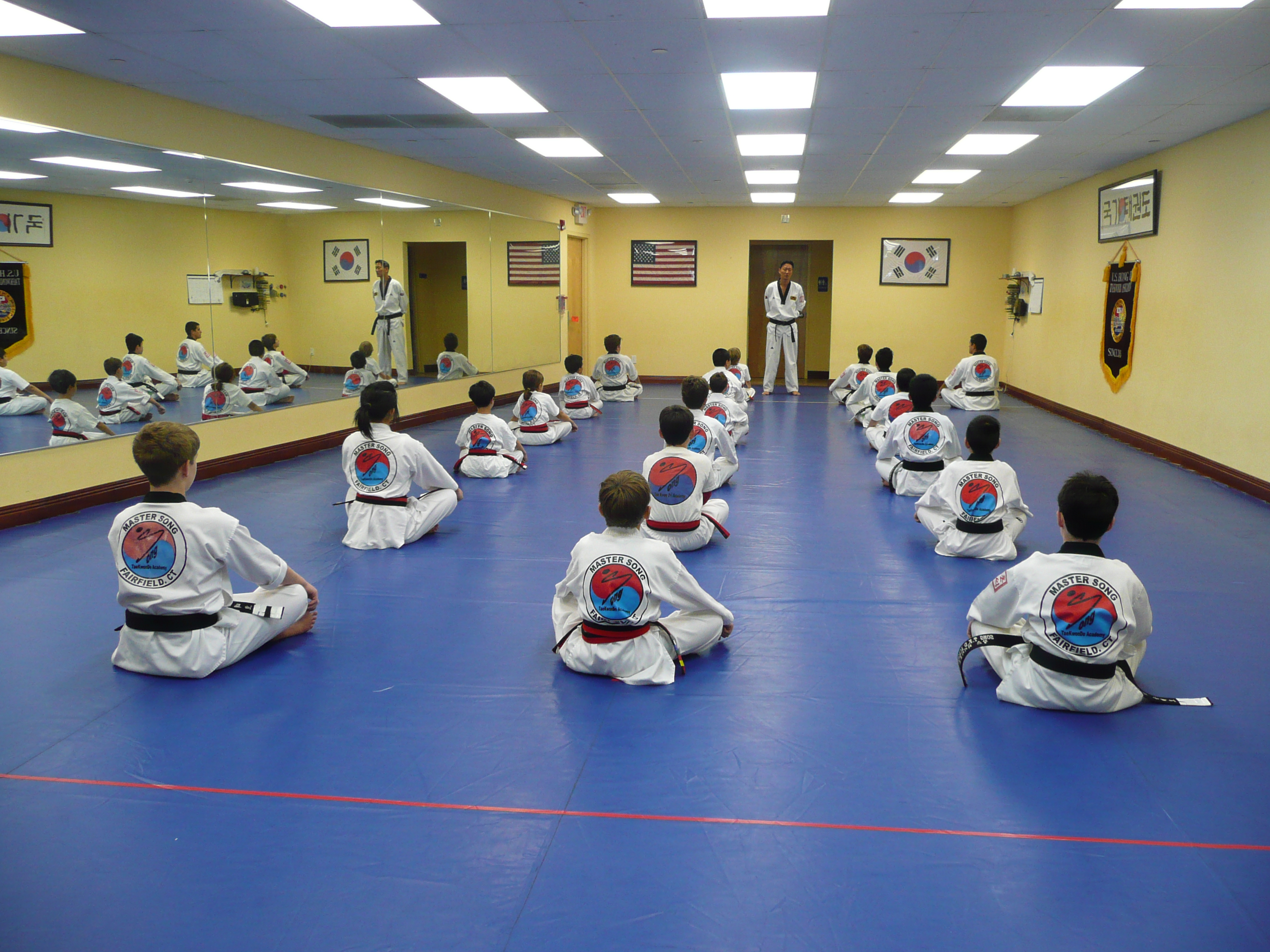 Children practicing Tae Kwon Do in class