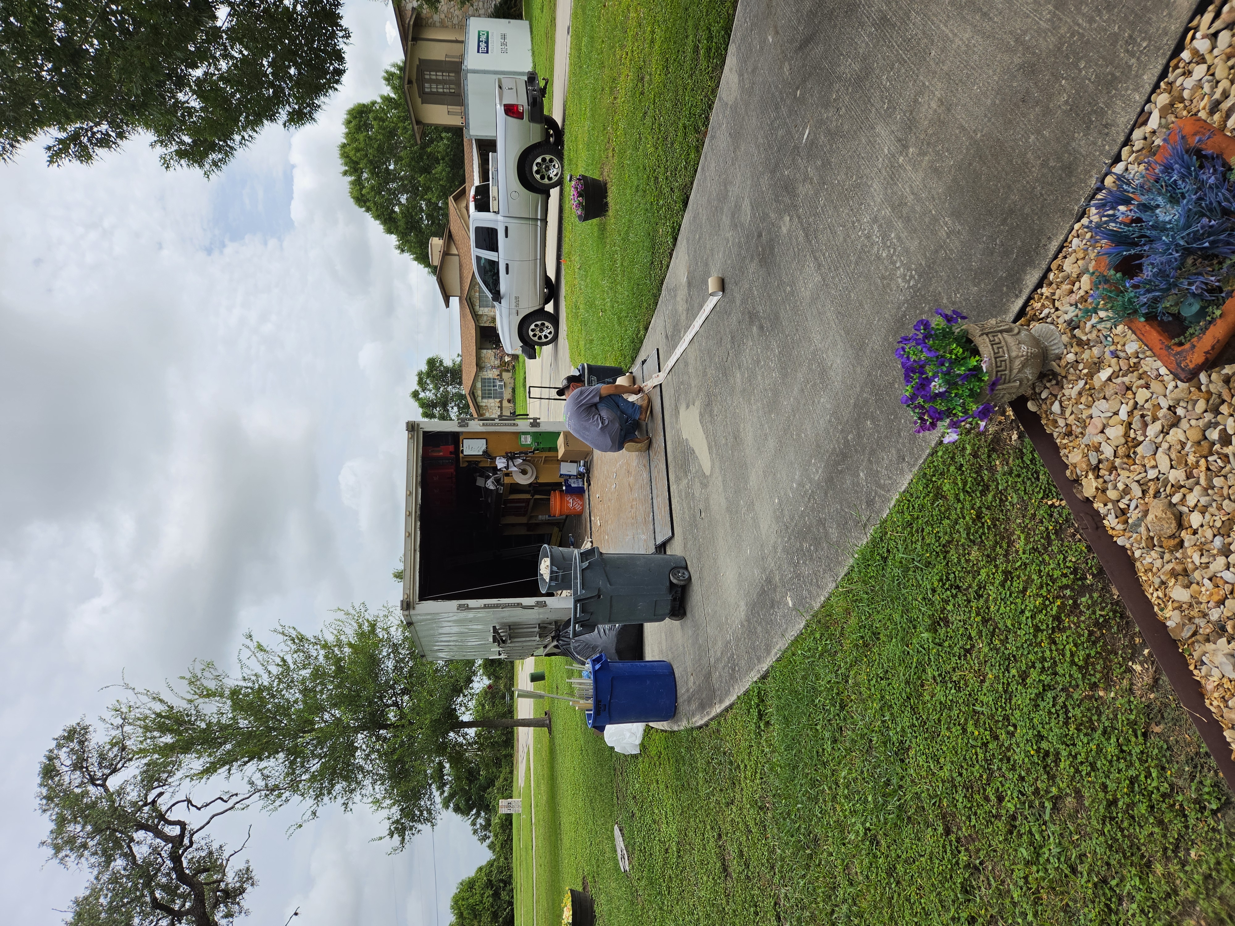 Newly installed double-hung replacement windows in a brick San Antonio home