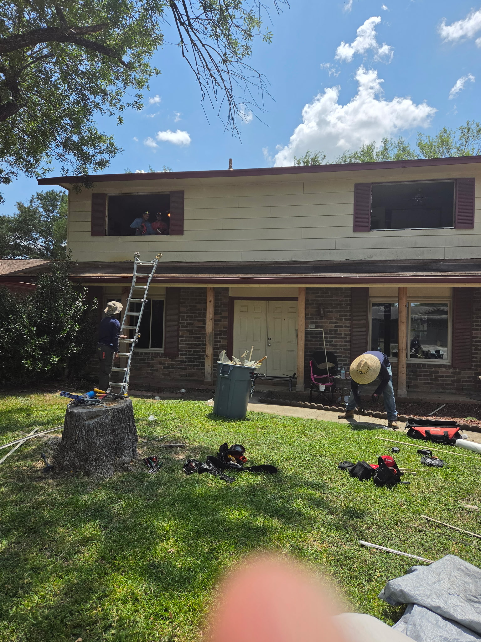 JTZ Window Company crew working on a two-story home installation in San Antonio