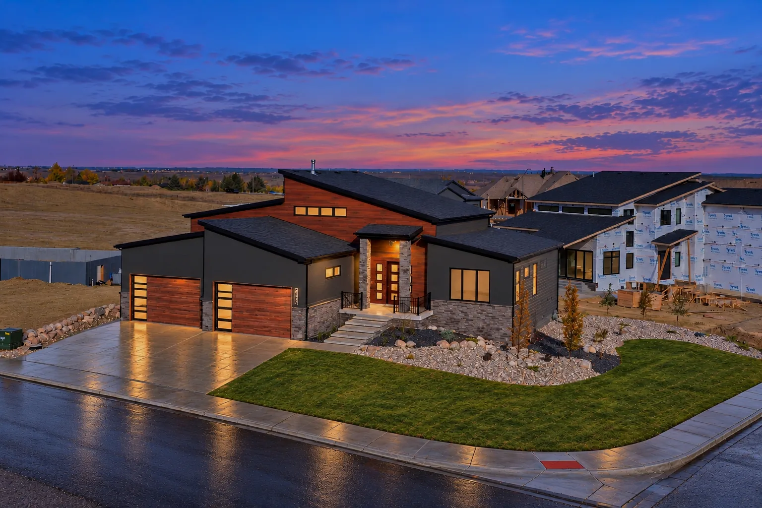 New custom home by Skyline Construction in Casper, WY lit up at twilight