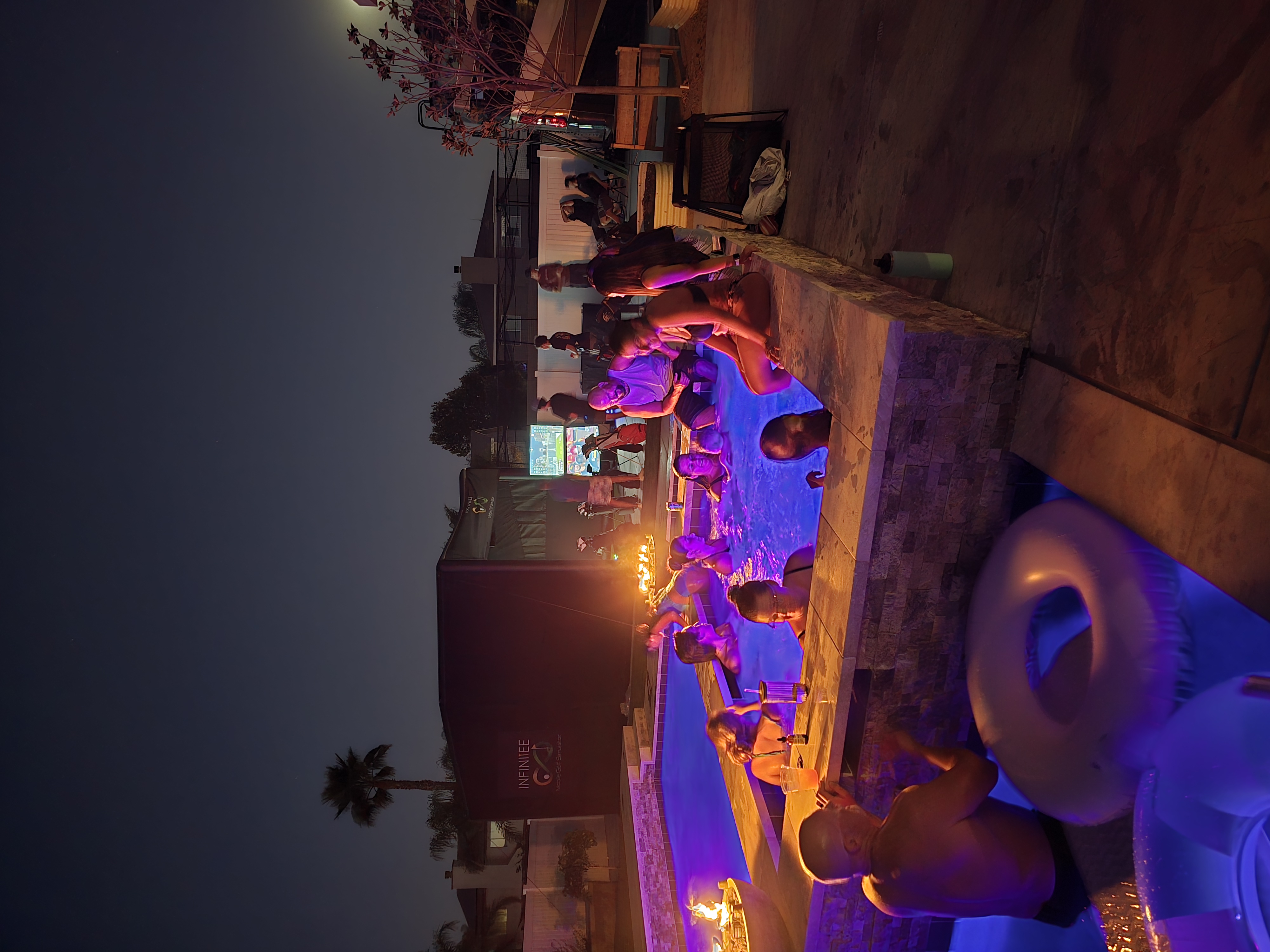 guests playing a mobile golf simulator at an event in Menifee, CA