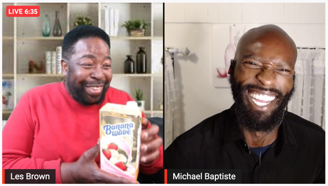 Les Brown holding a Banana Wave carton on a live stream with Michael Baptiste