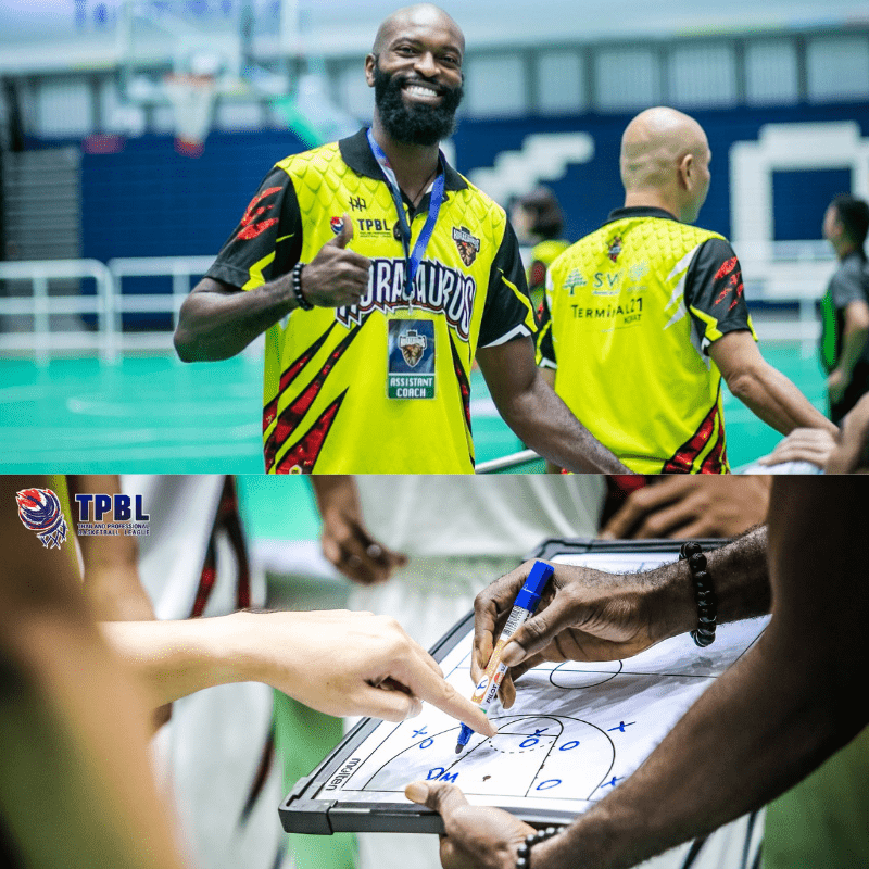 Michael Baptiste in a Korasaurus assistant coach jersey and drawing plays on a coaching board