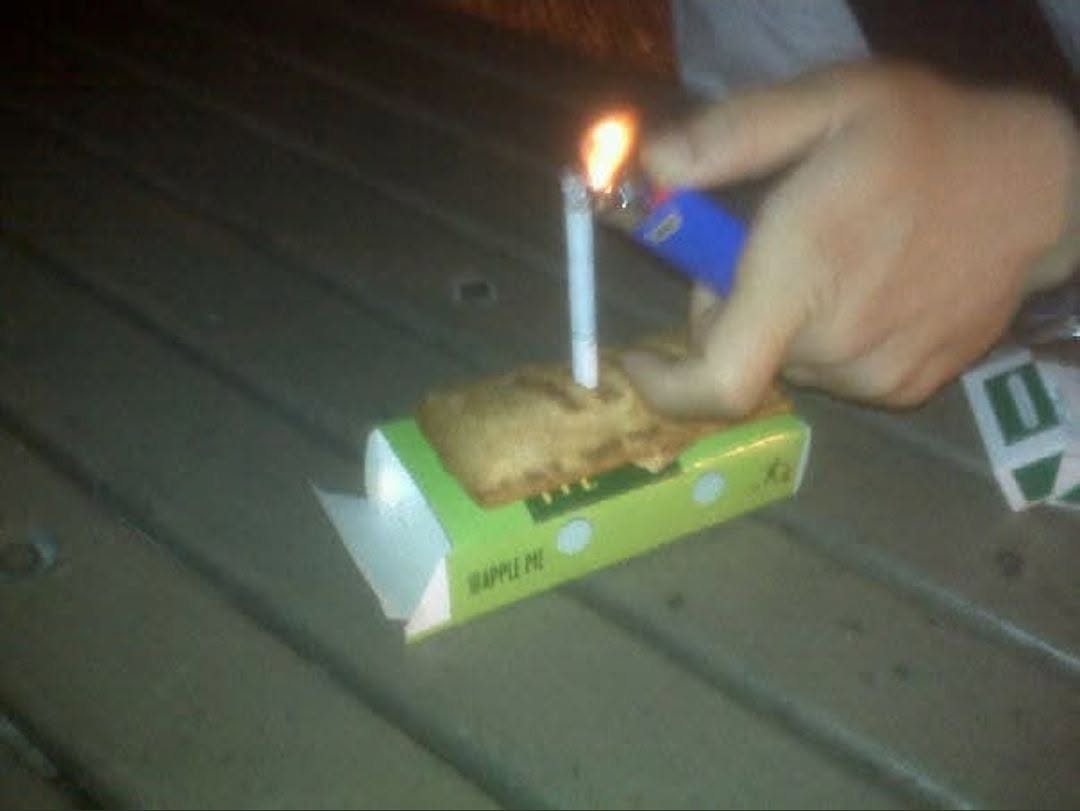 A McDonald's apple pie with a cigarette stuck in it as a birthday candle