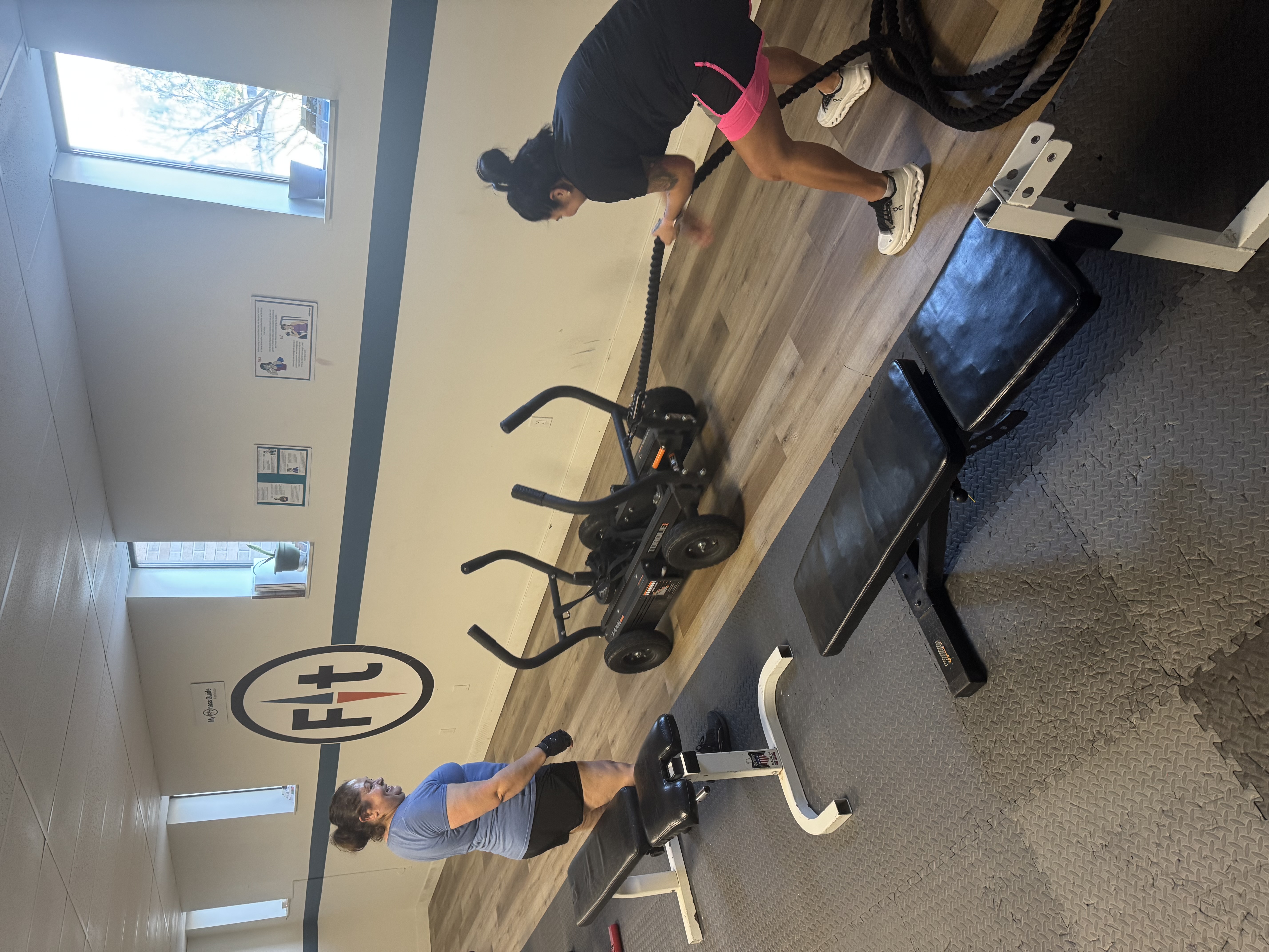 Personal trainer coaching members at My Fitness Guide, semi-private studio in West Lansing MI