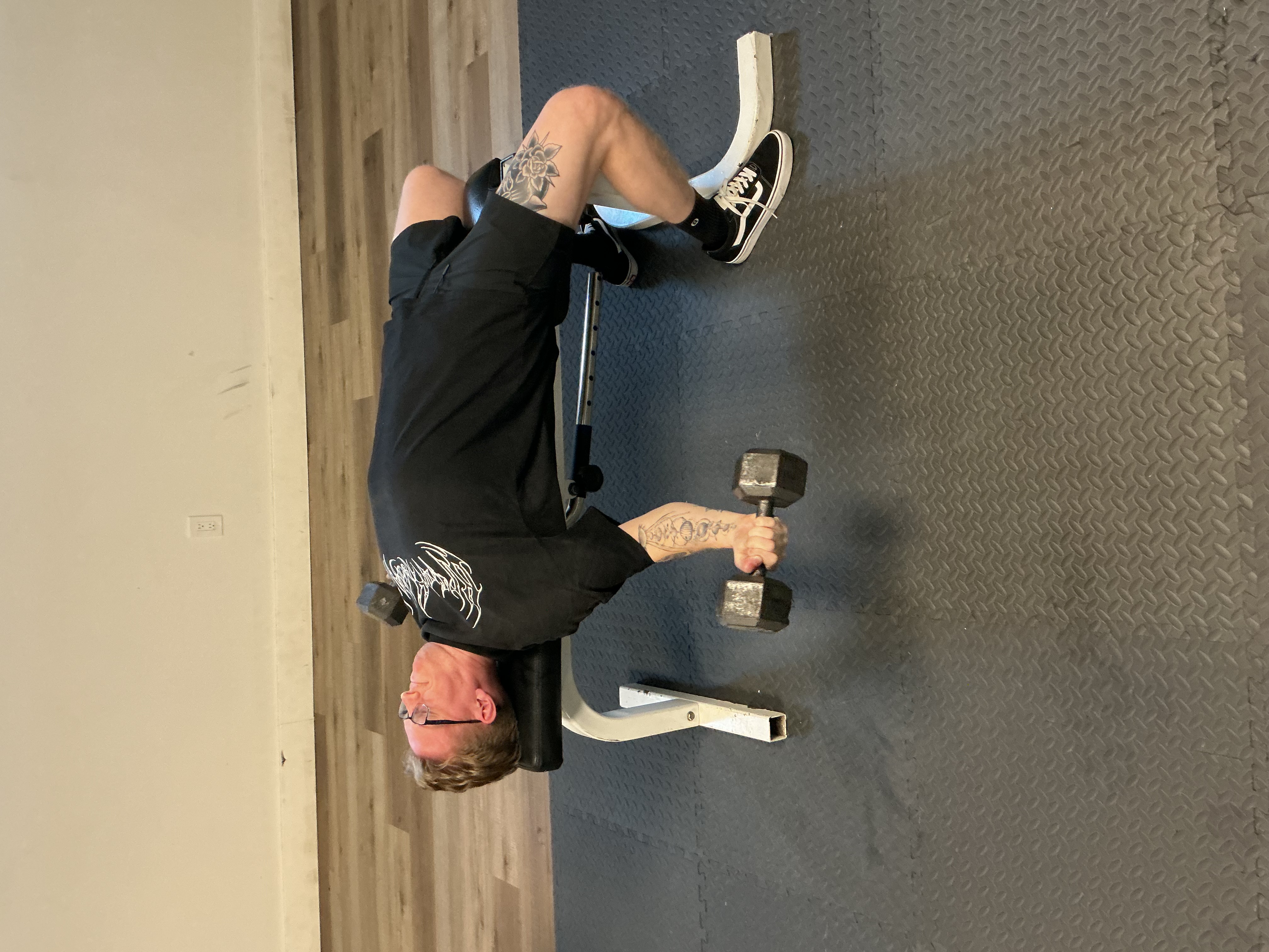 Personal trainer coaching strength training session, West Lansing MI