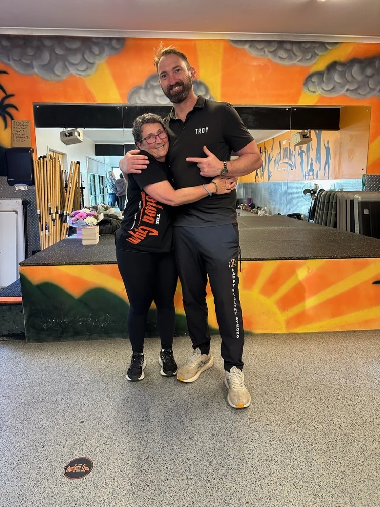 Troy with a smiling gym member