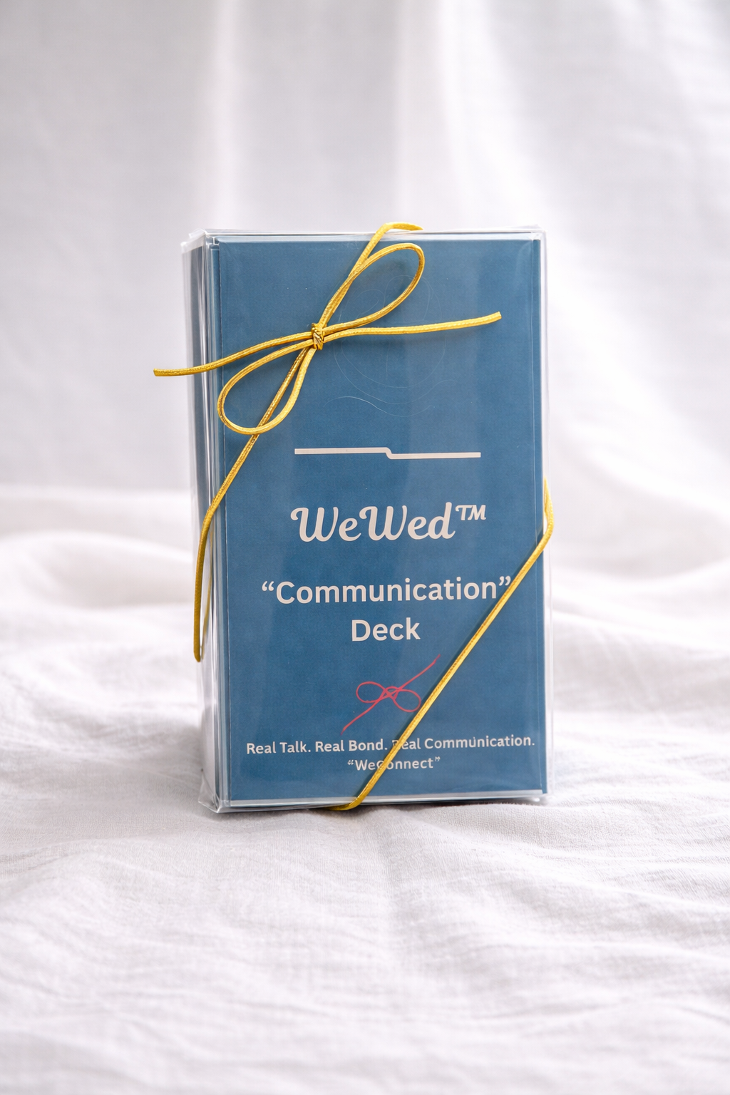 The WeWed Communication Deck, a set of 52 conversation cards for couples, in its branded case