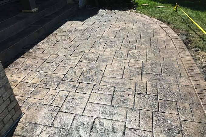 Decorative stamped concrete installation in Ward County ND