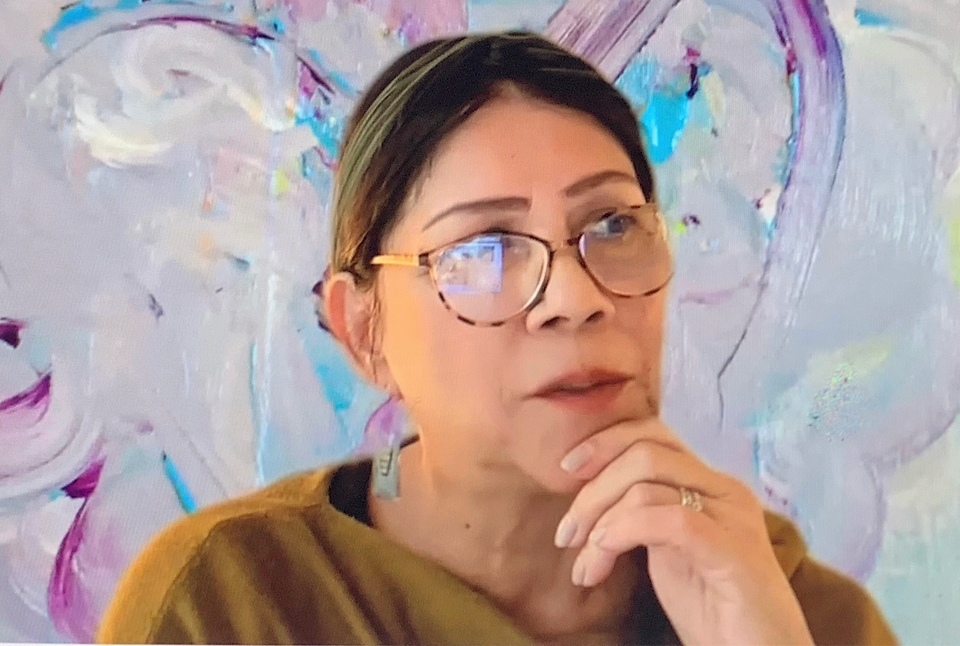 Woman with glasses looking on thew side thinking with hand in chin Woman with glasses looking on thew side thinking with hand in chin