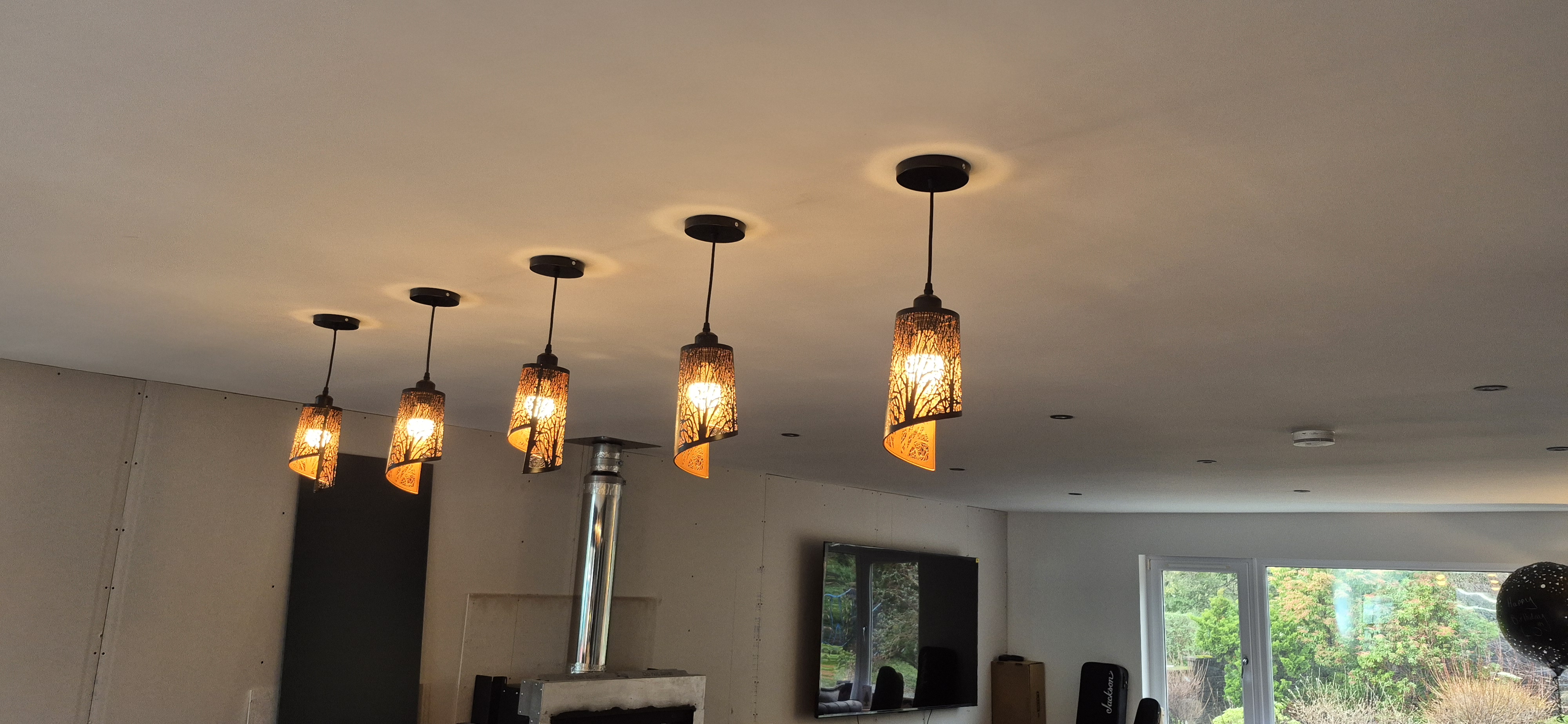 5 decorative pendant lights installed in a living room by Central Properties Electrical