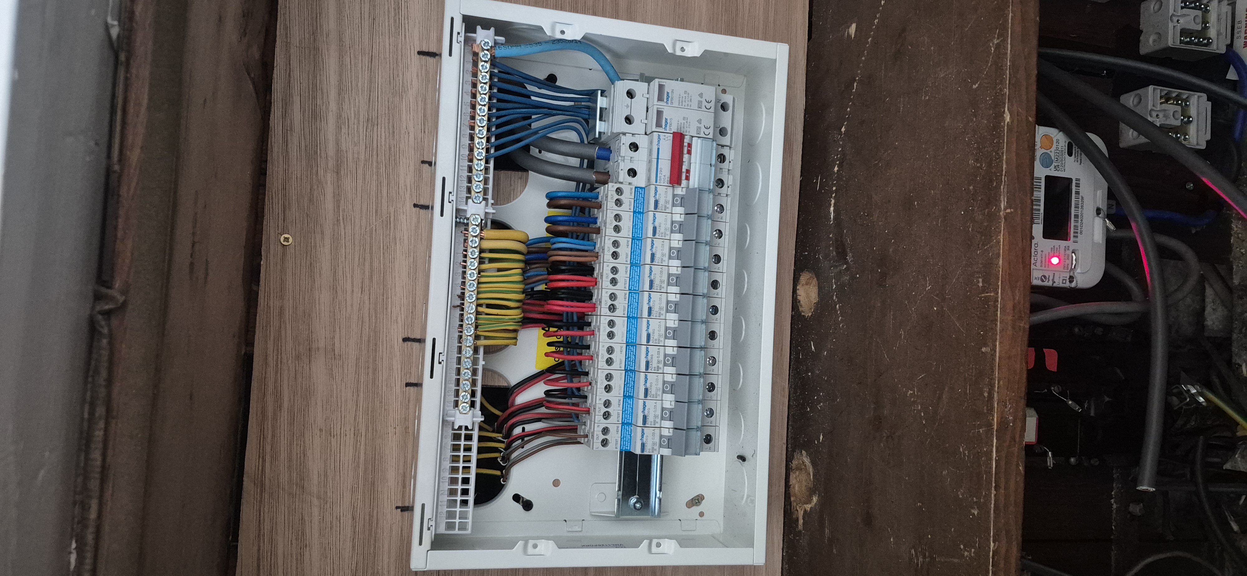 Open consumer unit showing full internal wiring