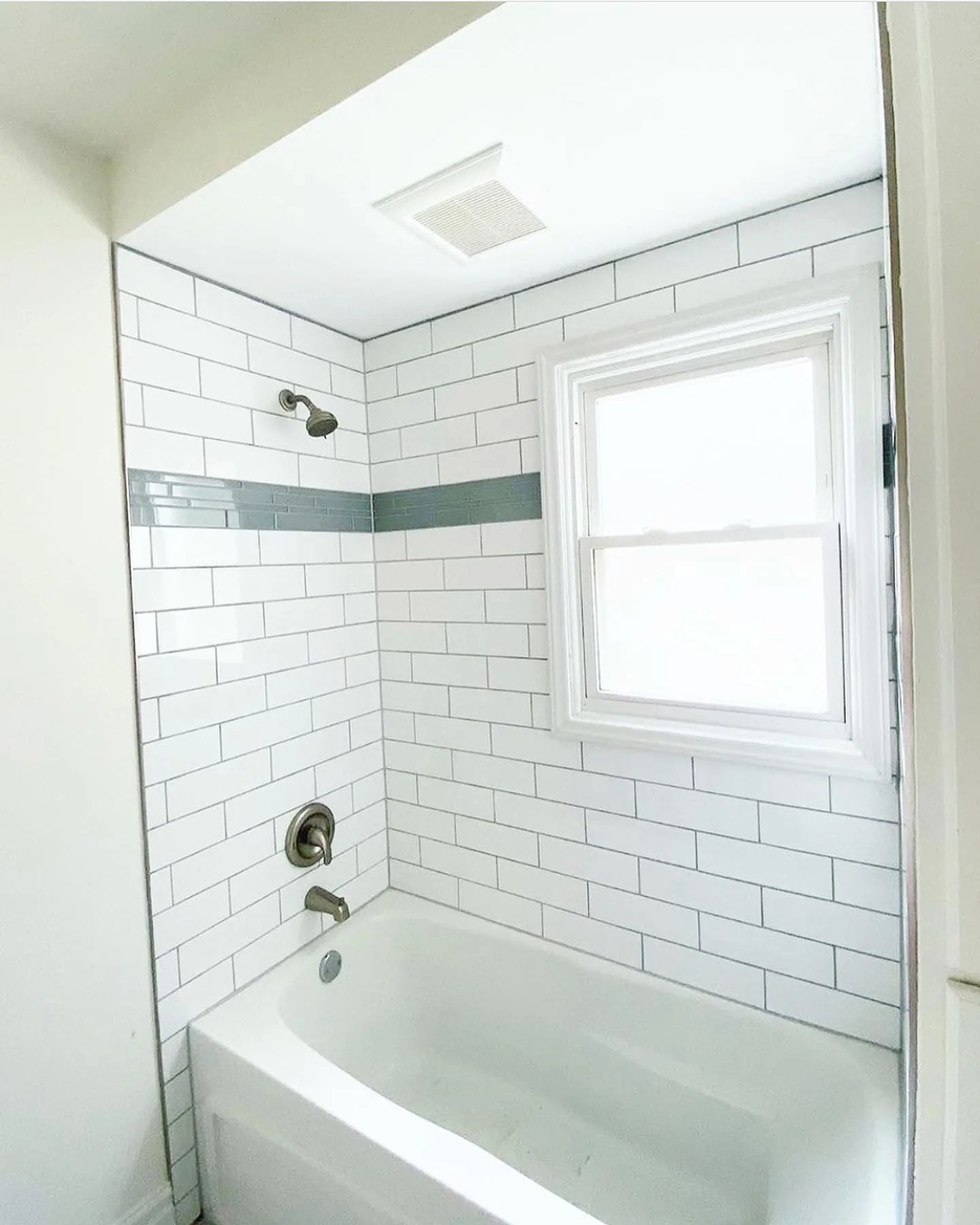 White subway tile bath surround