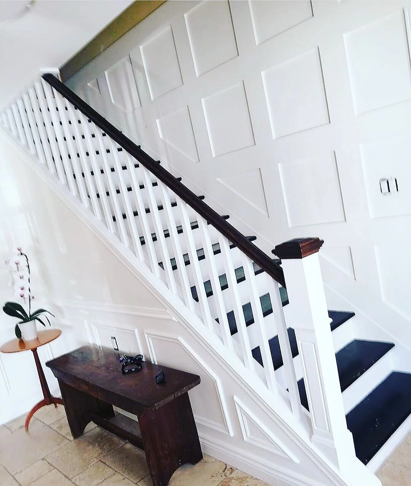 Refinished staircase with dark handrail
