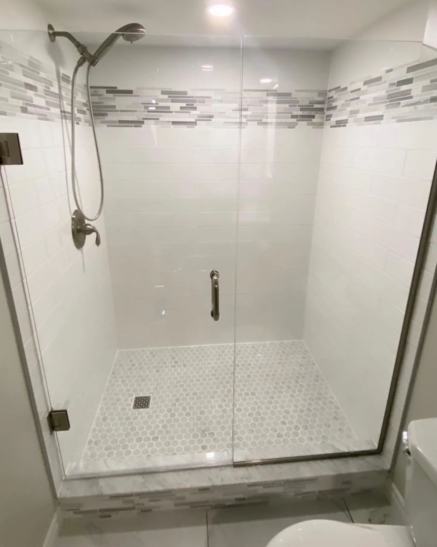 Frameless glass tiled shower