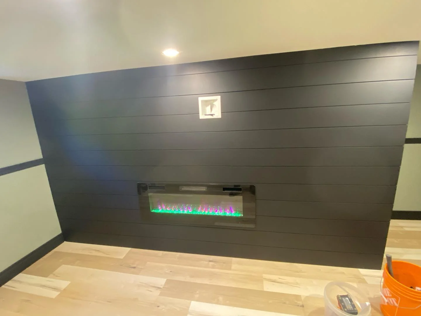Modern tiled fireplace installation