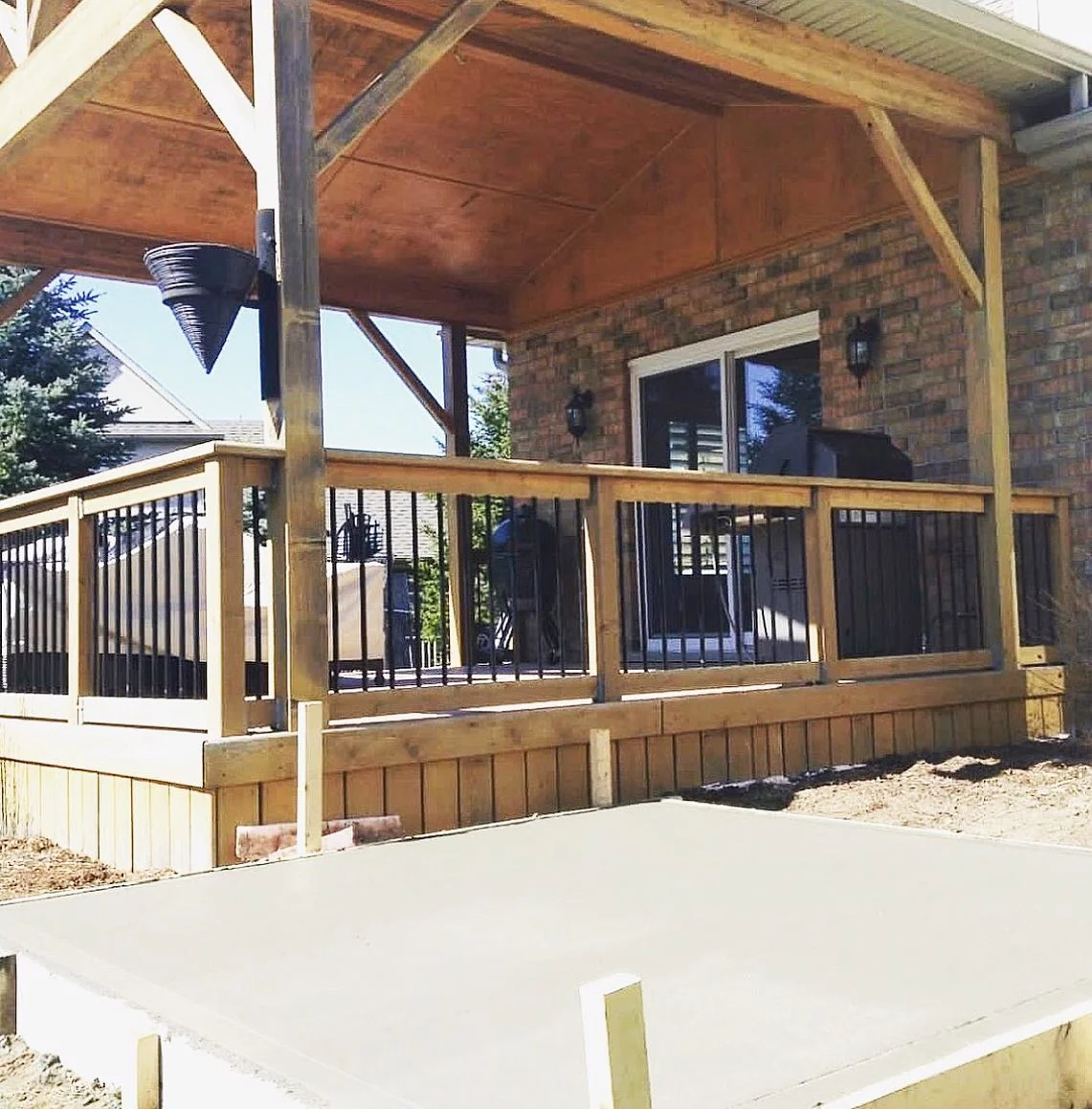 Covered outdoor living space and deck