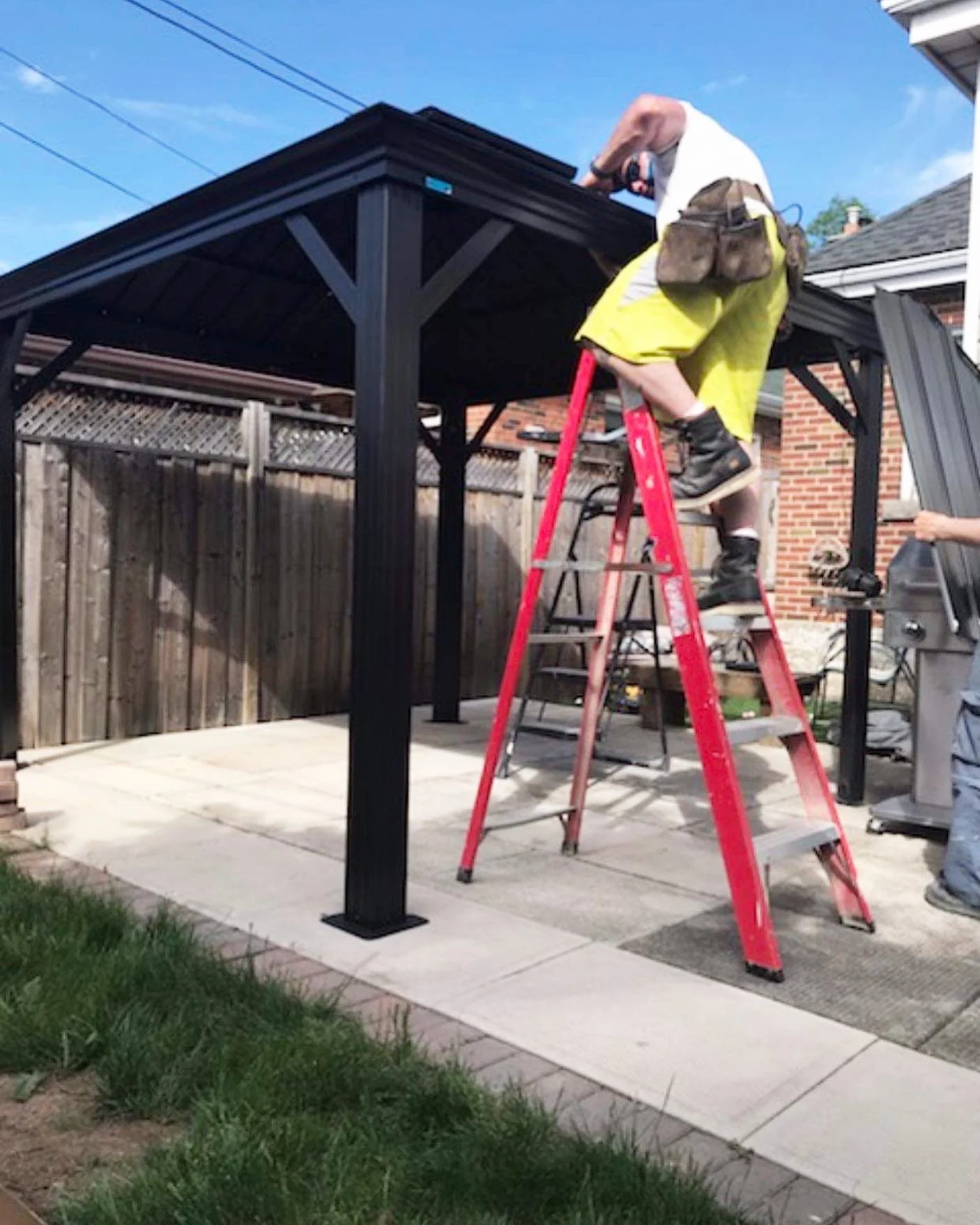 Black timber pergola over patio