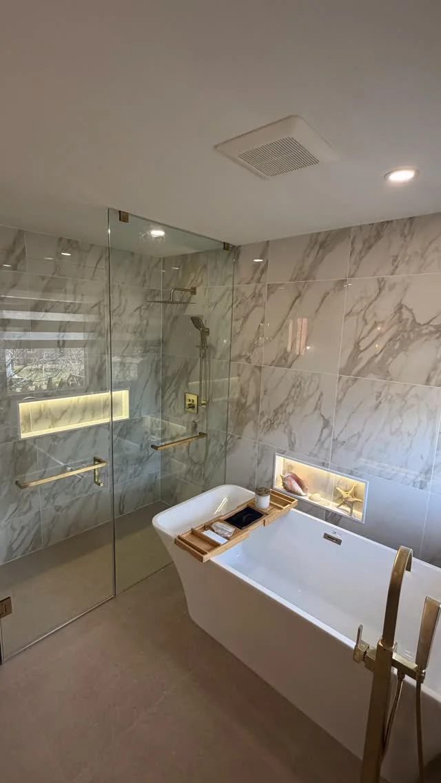 Luxury tiled bathroom with freestanding tub