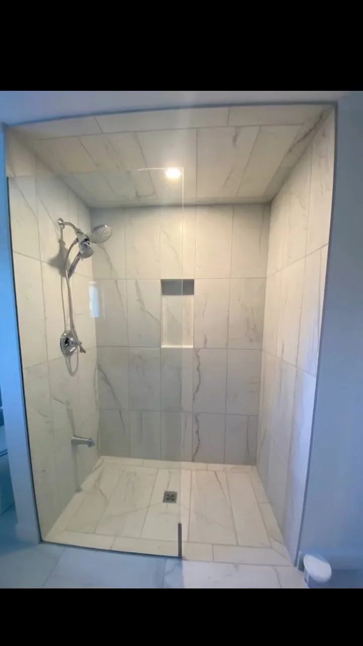 Finished marble-look tiled shower